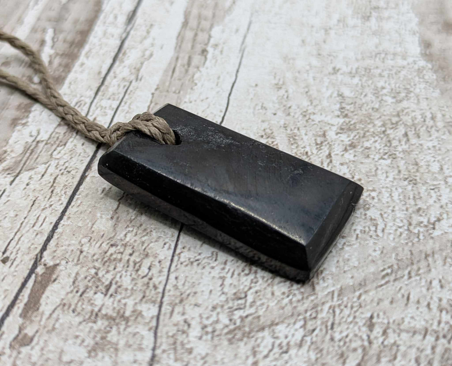 Sea coal rectangular pendant.