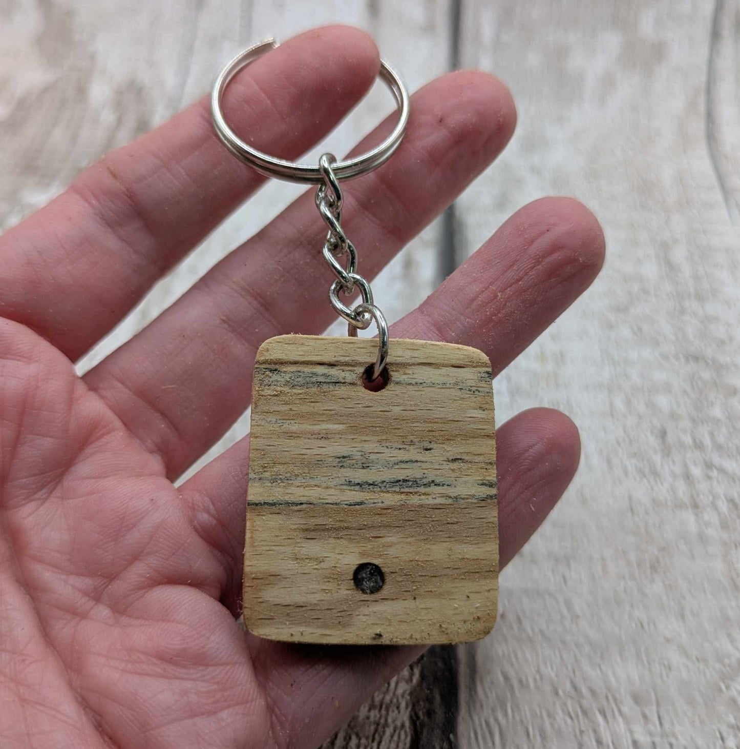Beech wood keyring with blue kyanite inlay.