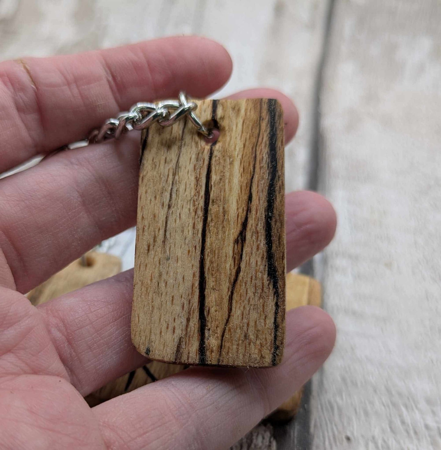 Spalted beech wood protection bind rune keyring.
