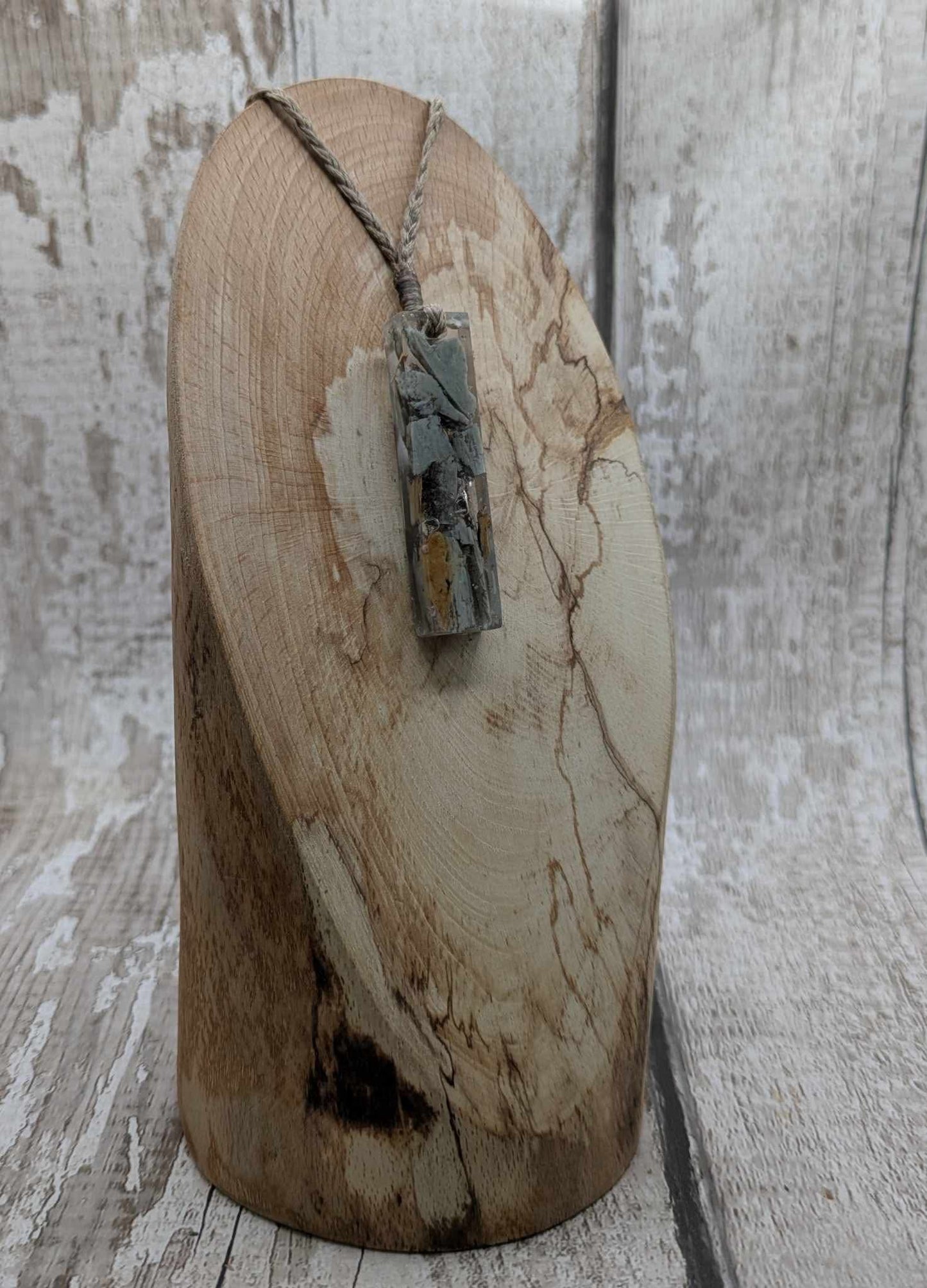 New Zealand Pounamu greenstone chip pendant in Uv resin casting.