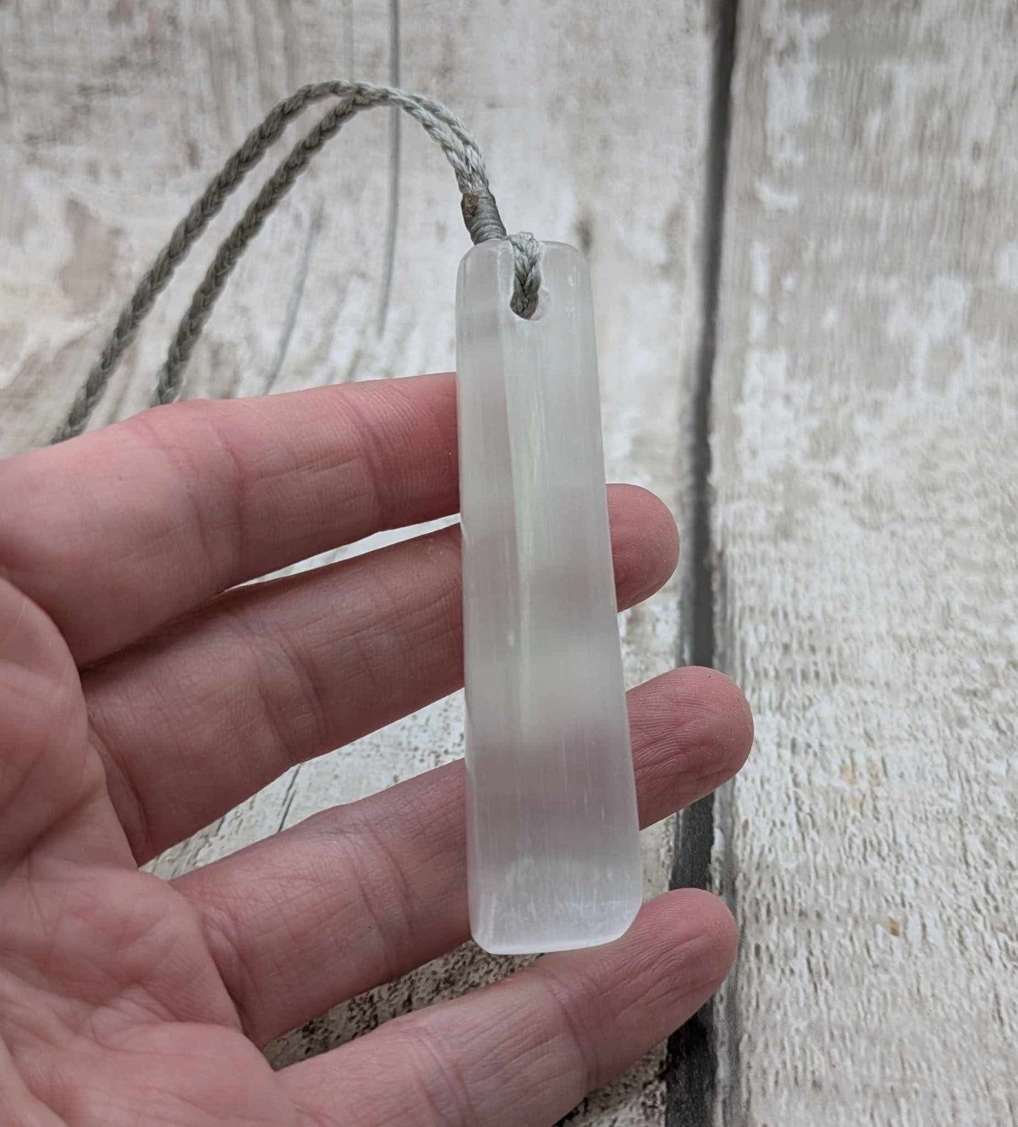 Selenite satin spar Toki pendant.