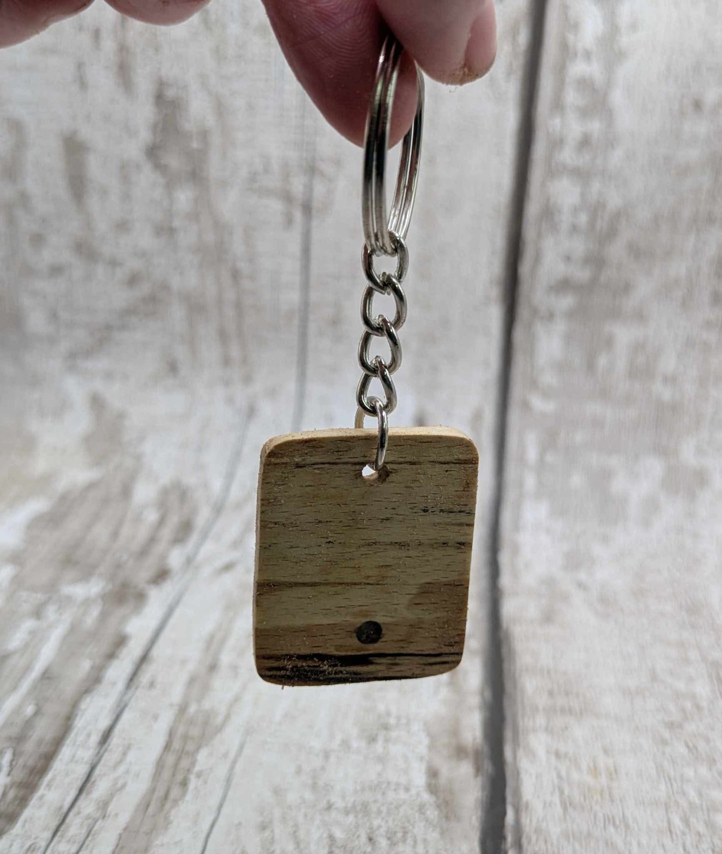 Beech wood keyring with blue kyanite inlay.
