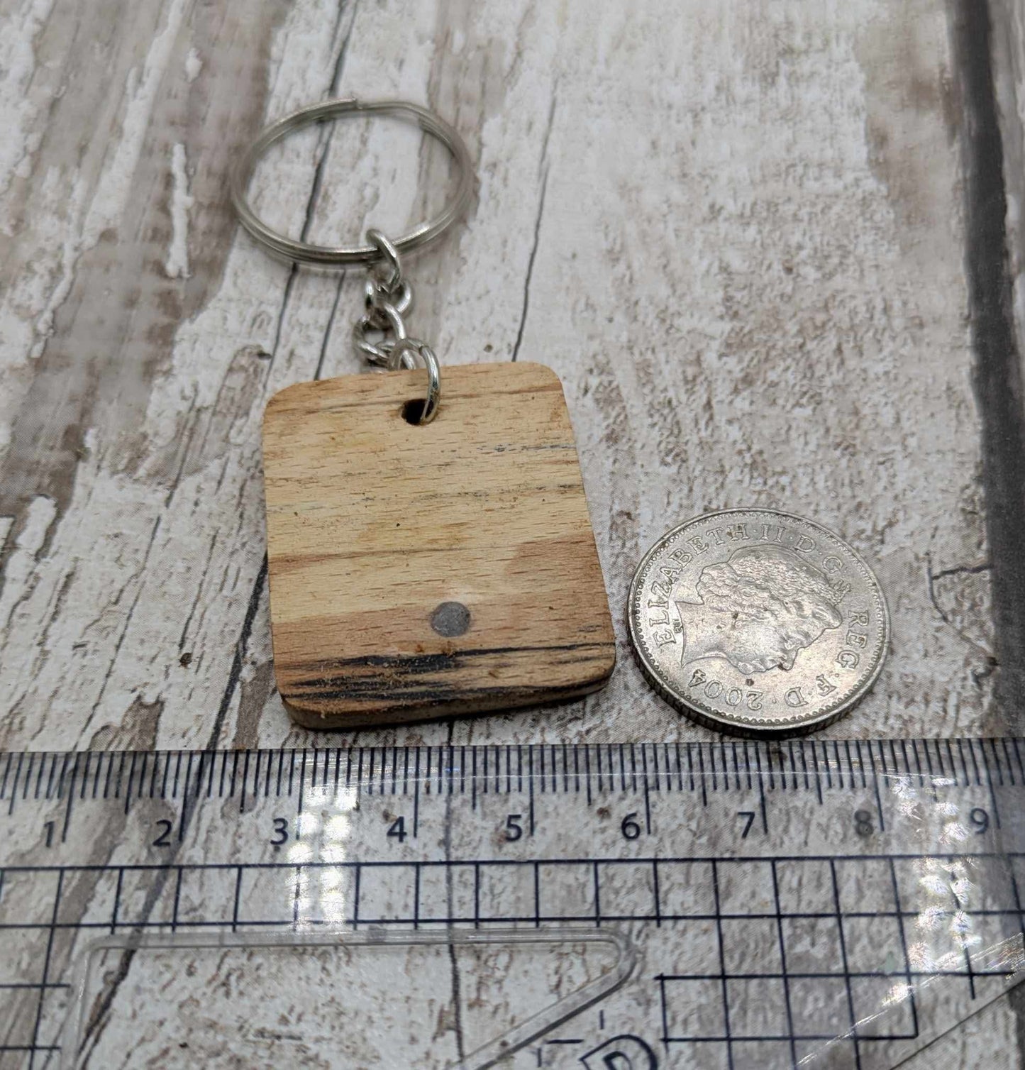 Beech wood keyring with blue kyanite inlay.