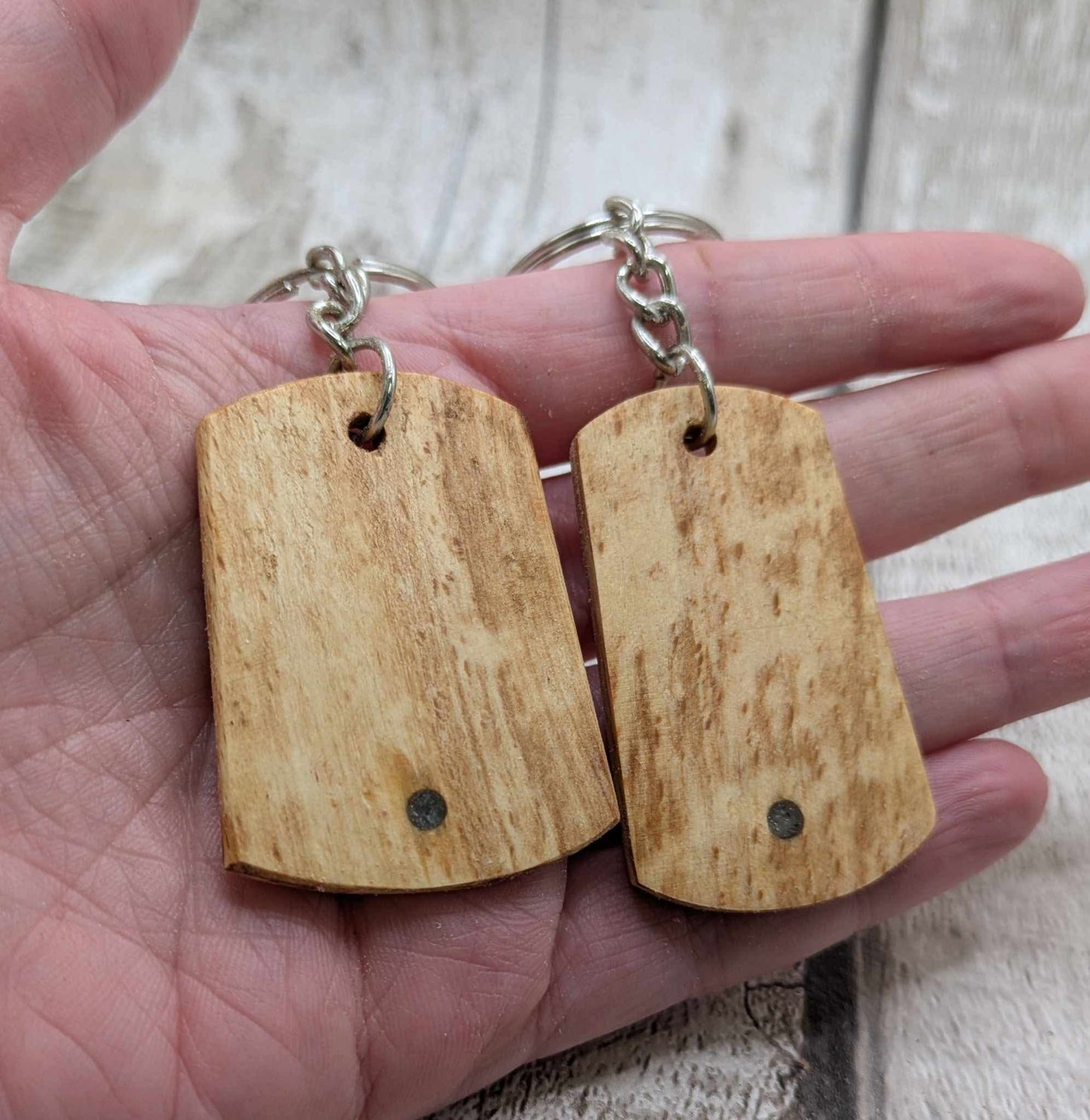 Beech wood keyrings and blue kyanite inlay.