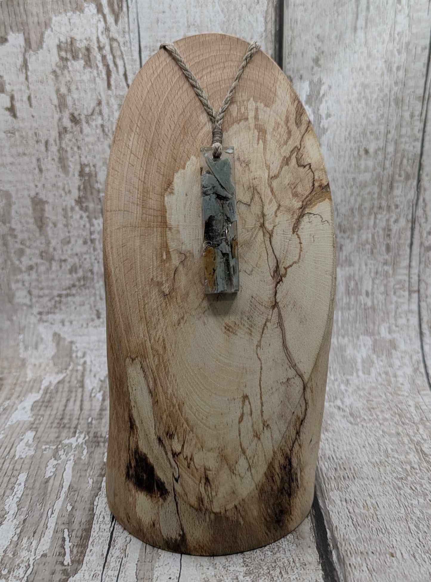 New Zealand Pounamu greenstone chip pendant in Uv resin casting.
