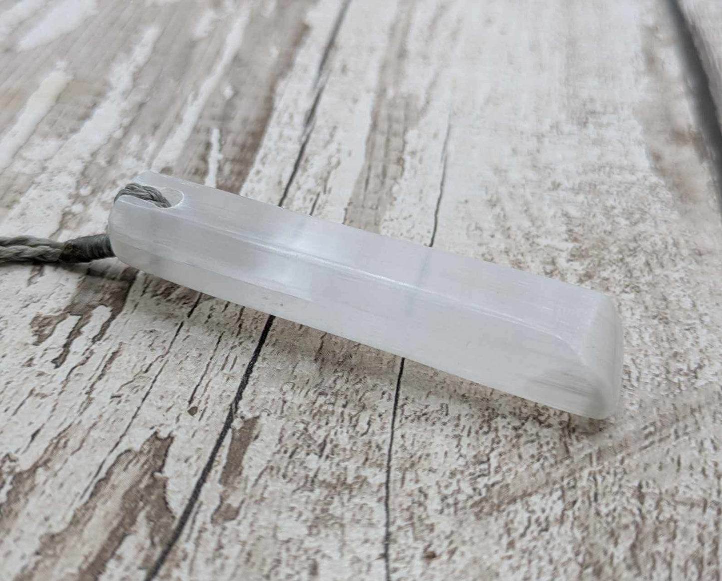 Selenite satin spar Toki pendant.