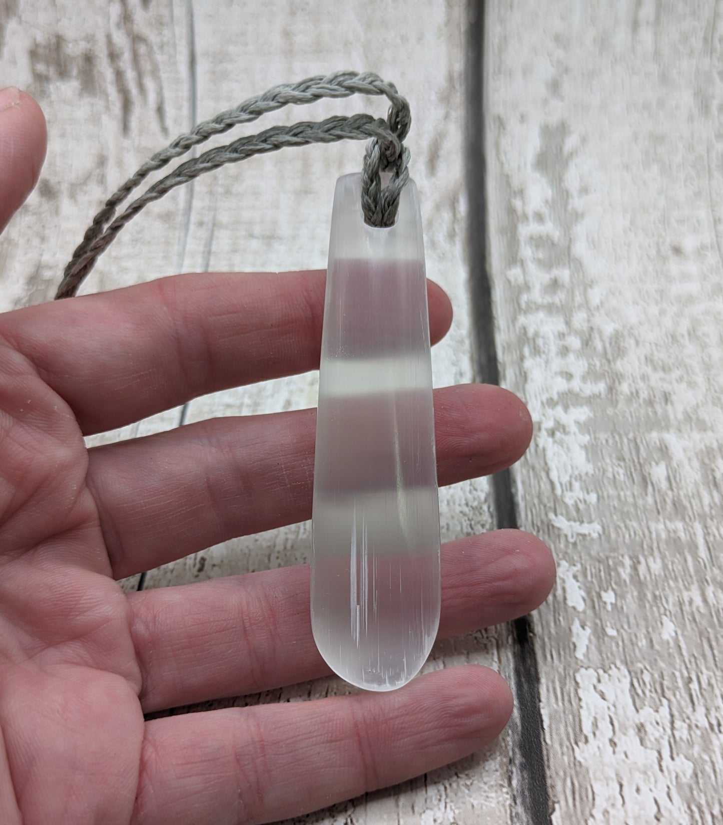 Selenite satin spar roimata teardrop pendant.