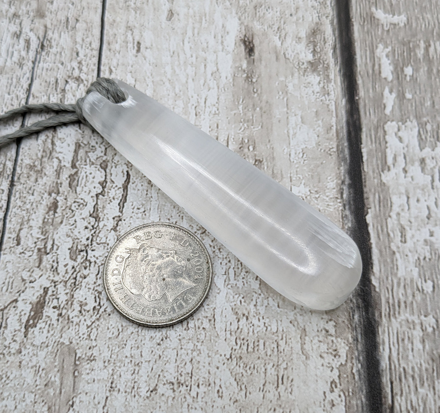 Selenite satin spar roimata teardrop pendant.