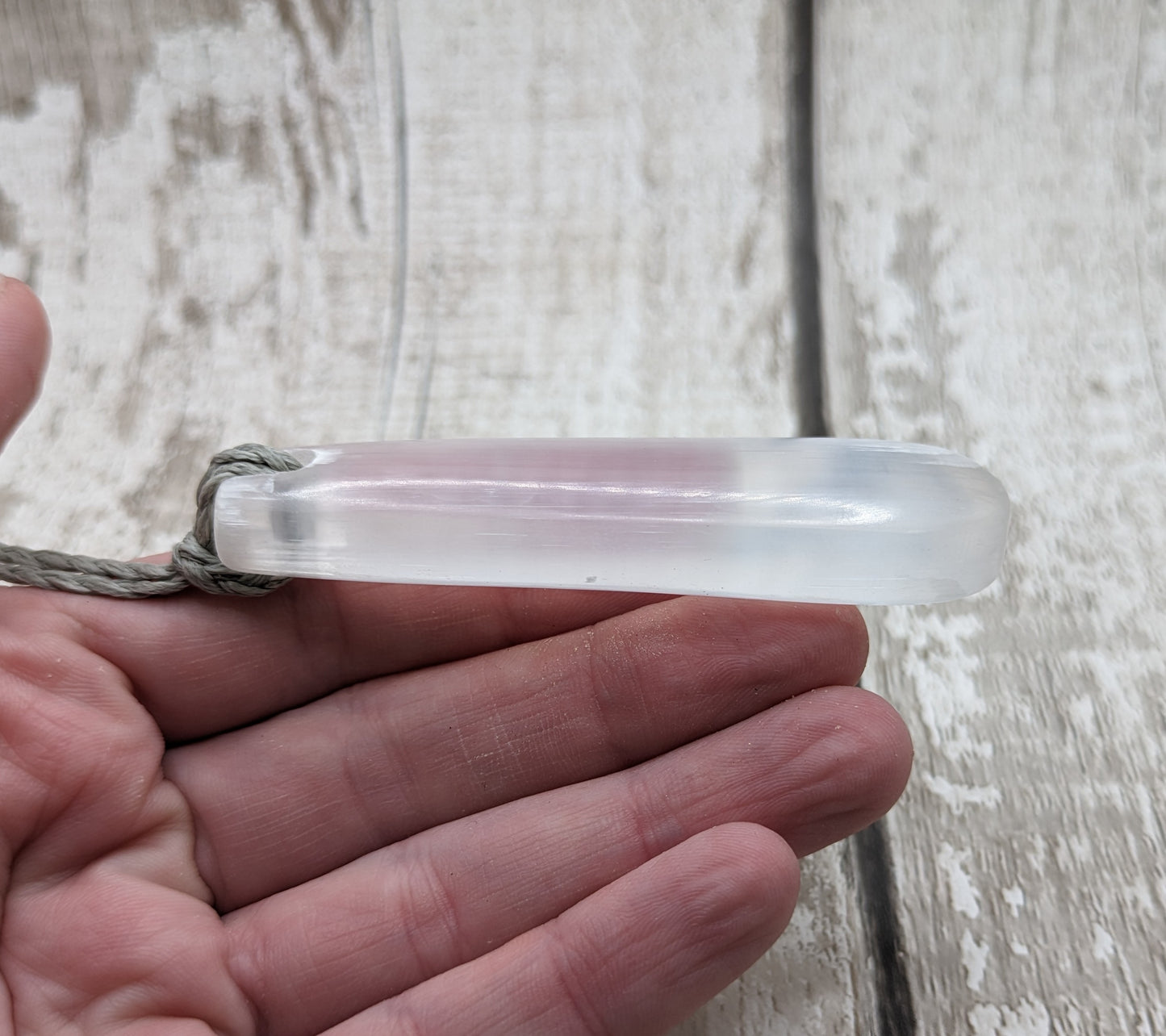 Selenite satin spar roimata teardrop pendant.