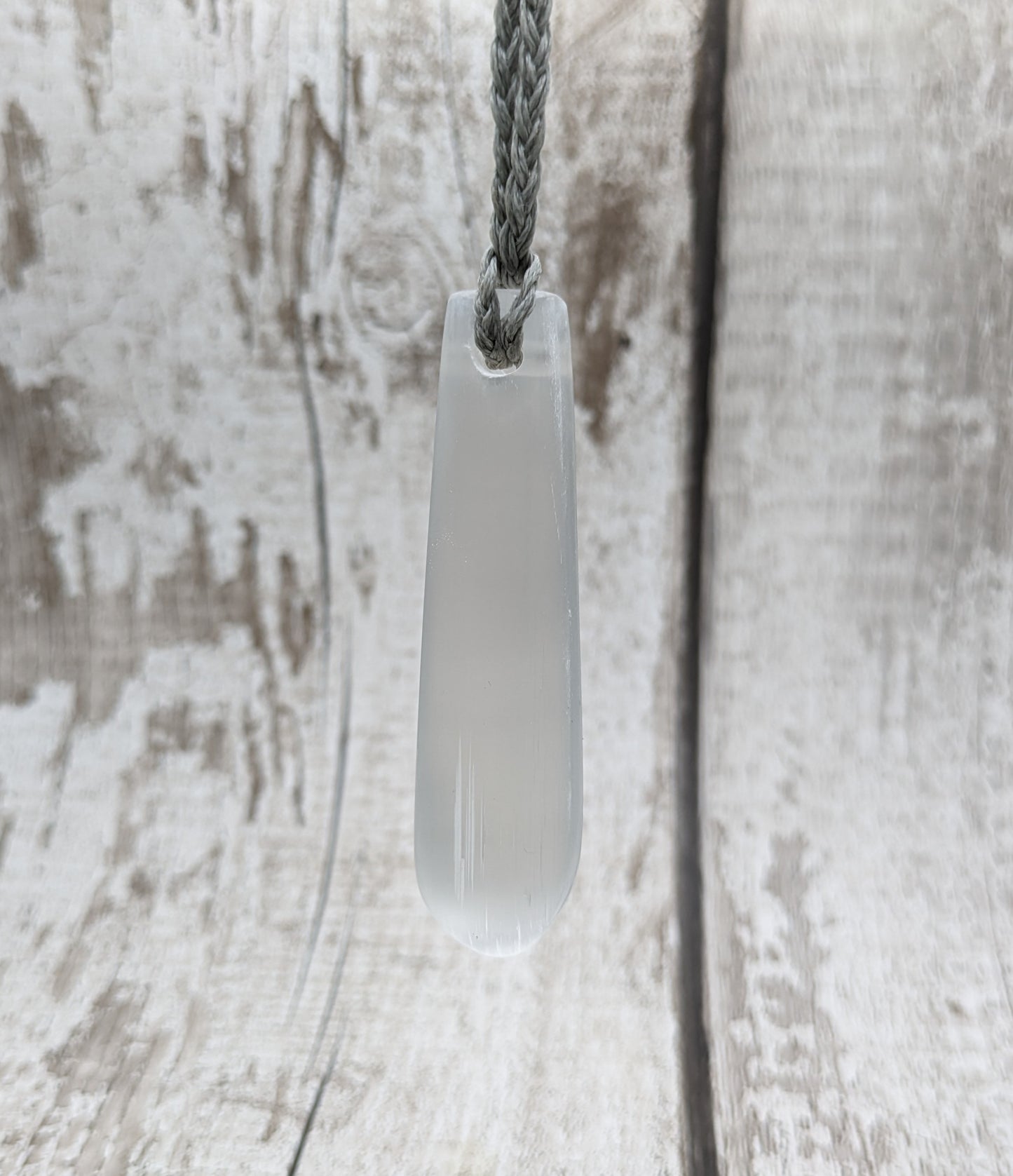 Selenite satin spar roimata teardrop pendant.