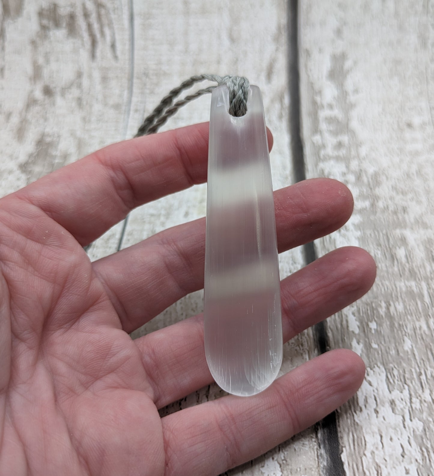 Selenite satin spar roimata teardrop pendant.