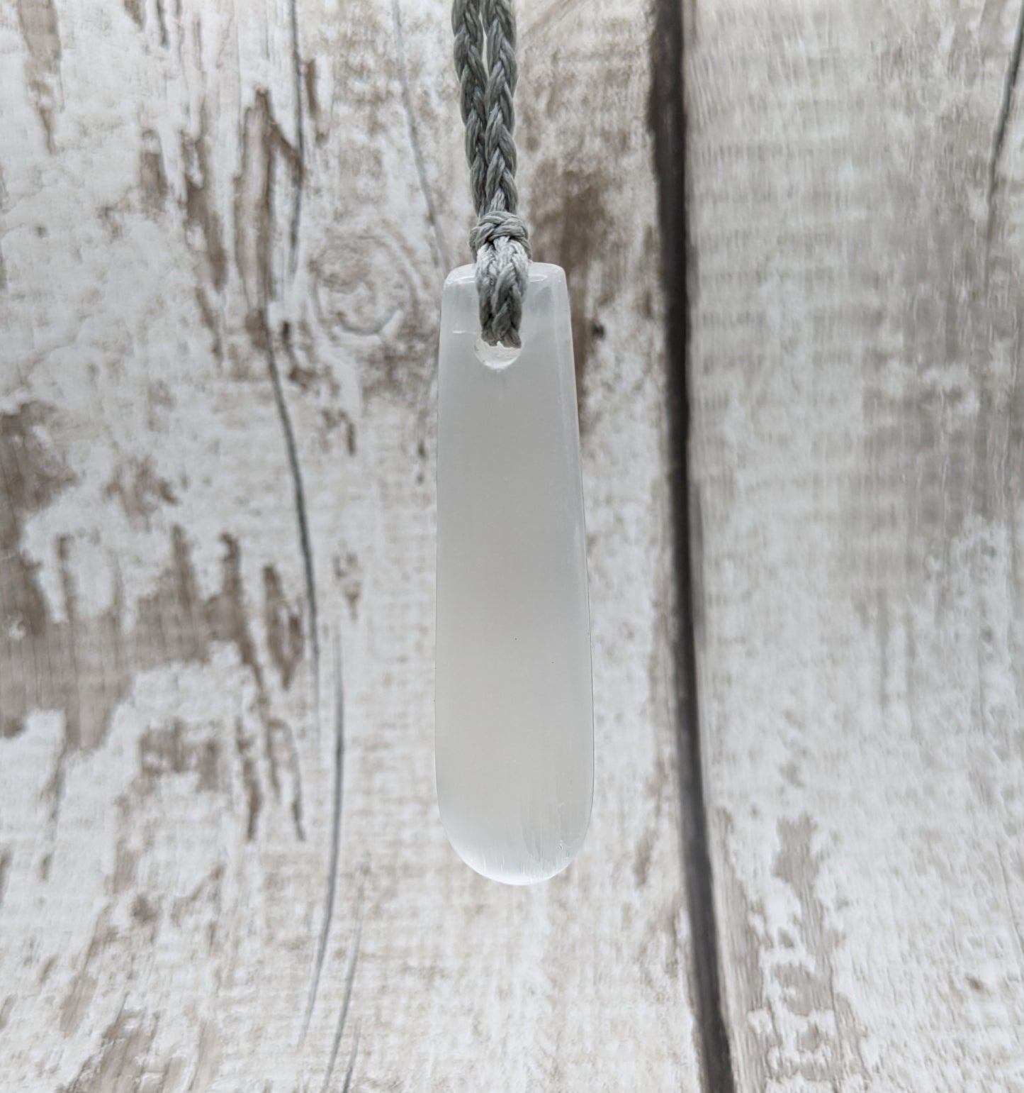 Selenite satin spar roimata teardrop pendant.