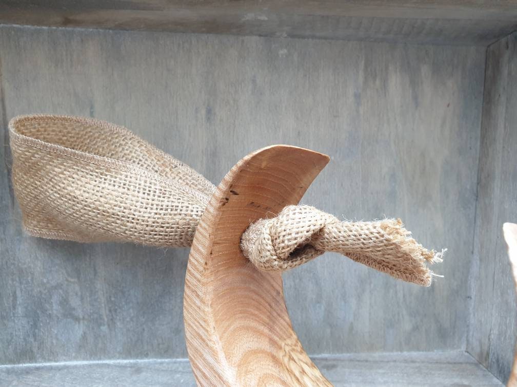 Wooden hanging moon ornament with hessian ribbon.