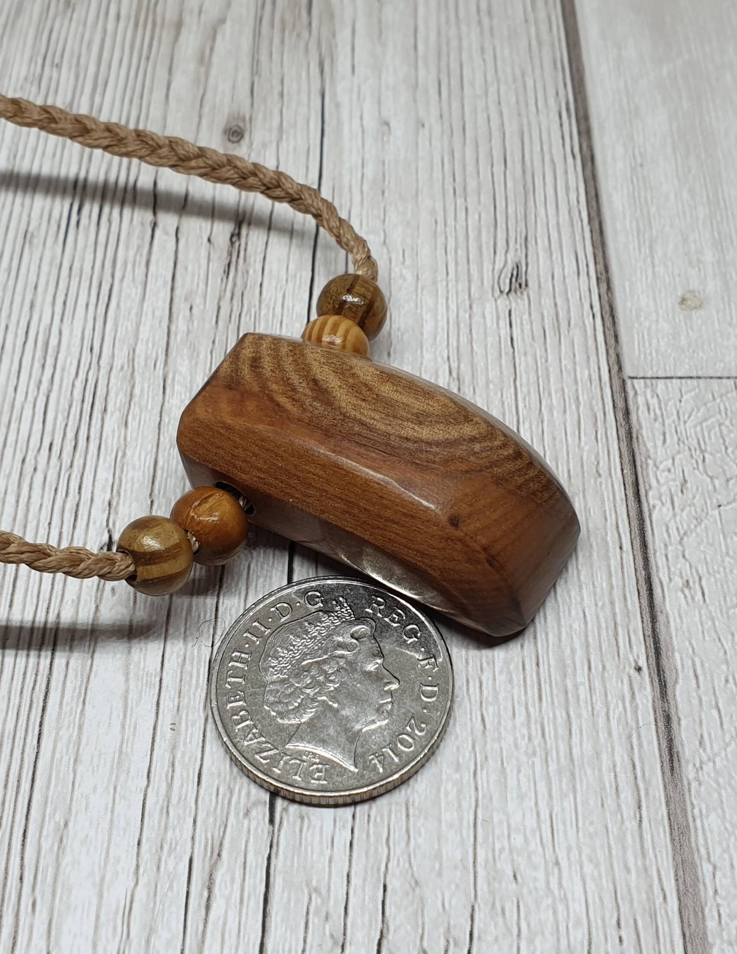 New Zealand Rimu wood Toki Adze pendant.