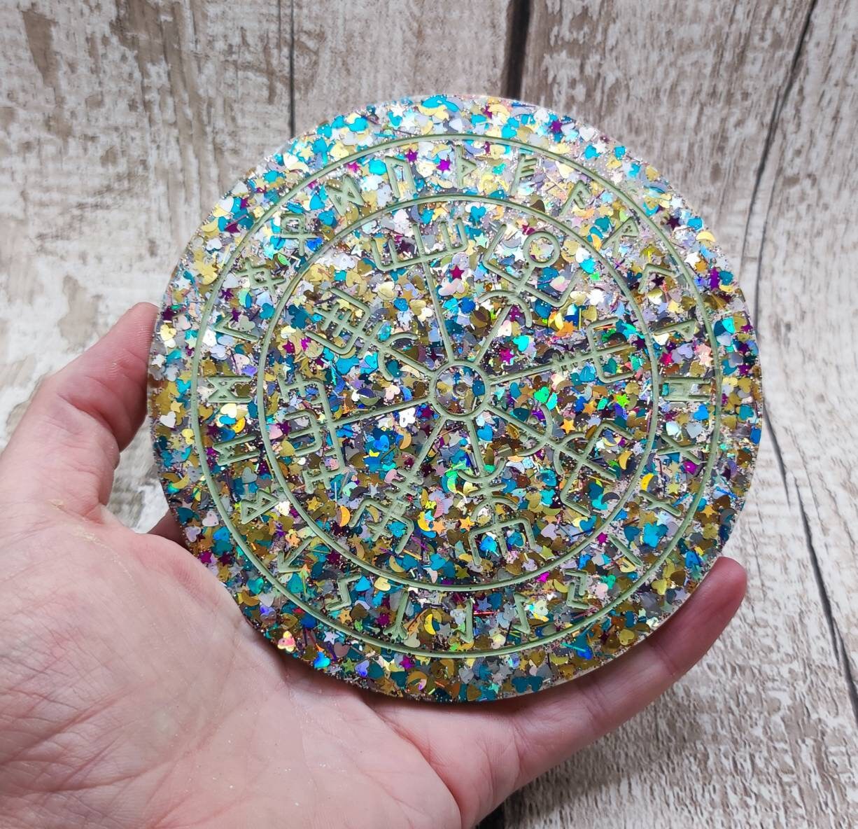 Glitter filled runic divination compass board incense holder.