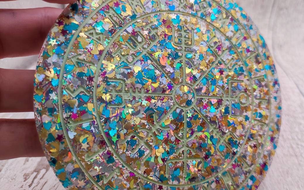 Glitter filled runic divination compass board incense holder.
