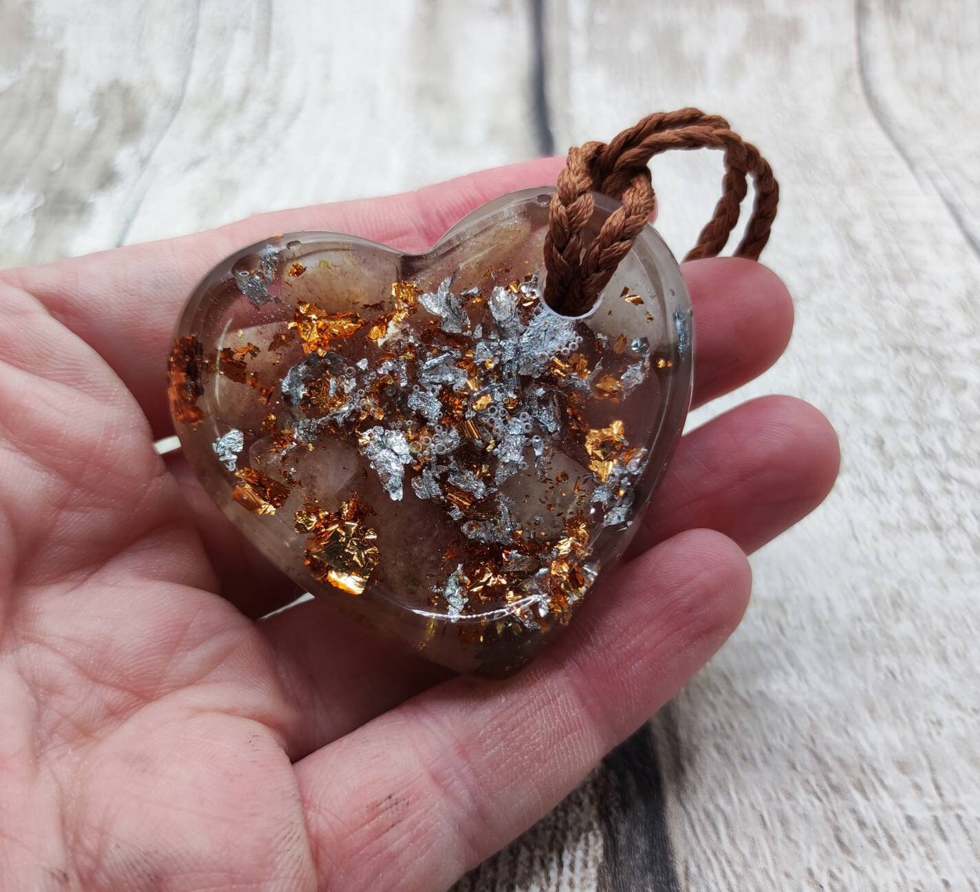Strawberry quartz with copper and Italian silver leaf in epoxy resin heart pendant.