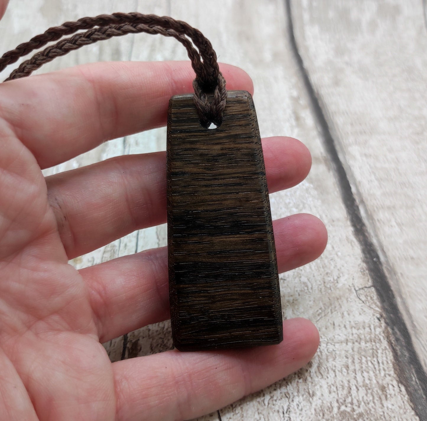 Bog oak heintoki adze styled unisex pendant.