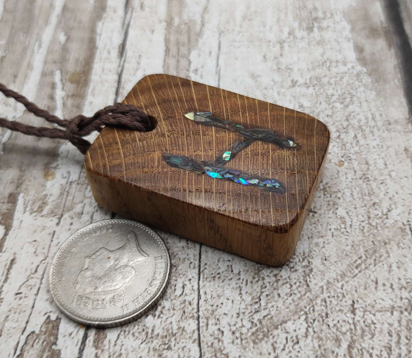 4 pack oak wood rune Christmas decoration with pāua shell.