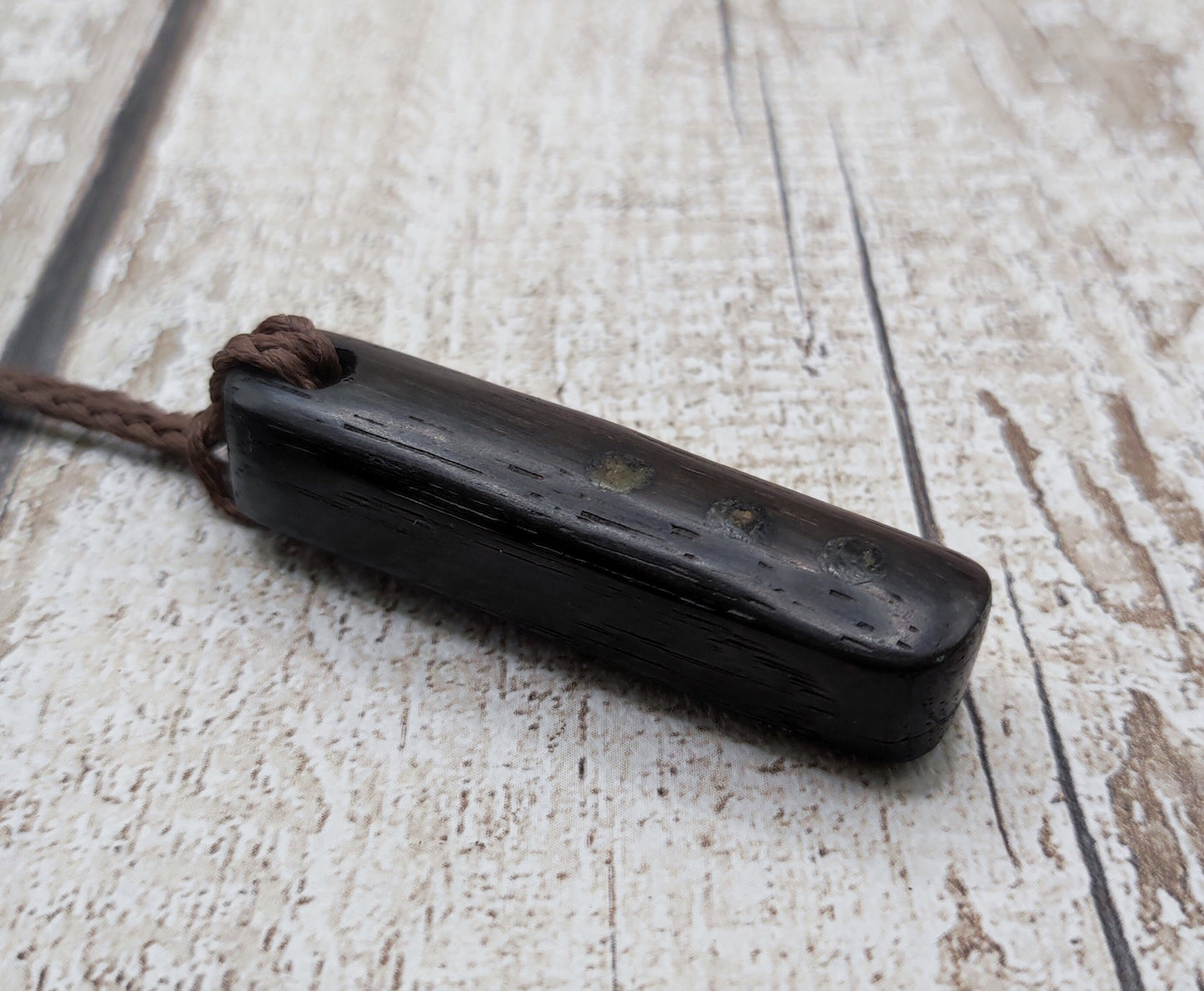 Bog oak wood and moldavite roimata pendant.