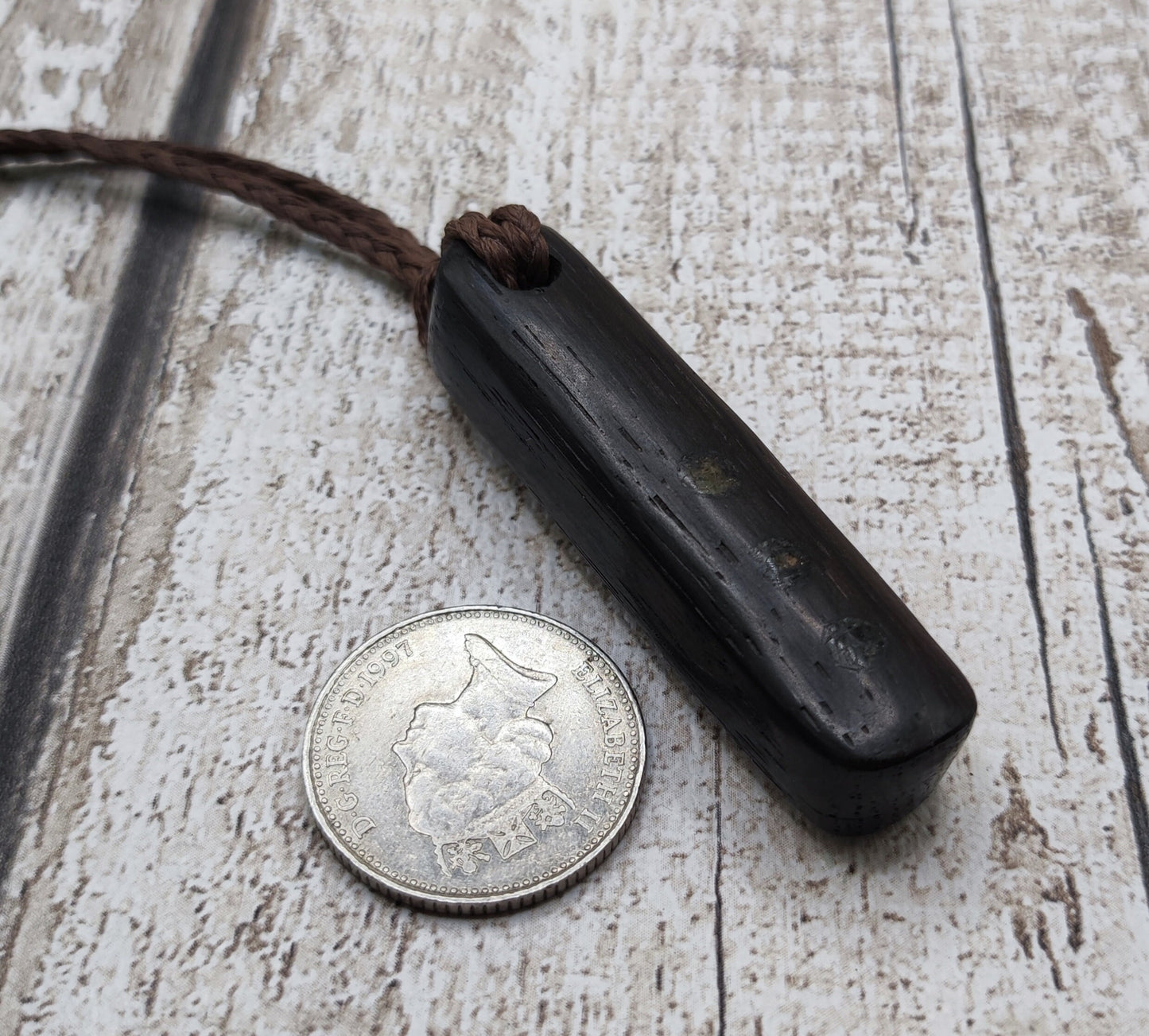 Bog oak wood and moldavite roimata pendant.
