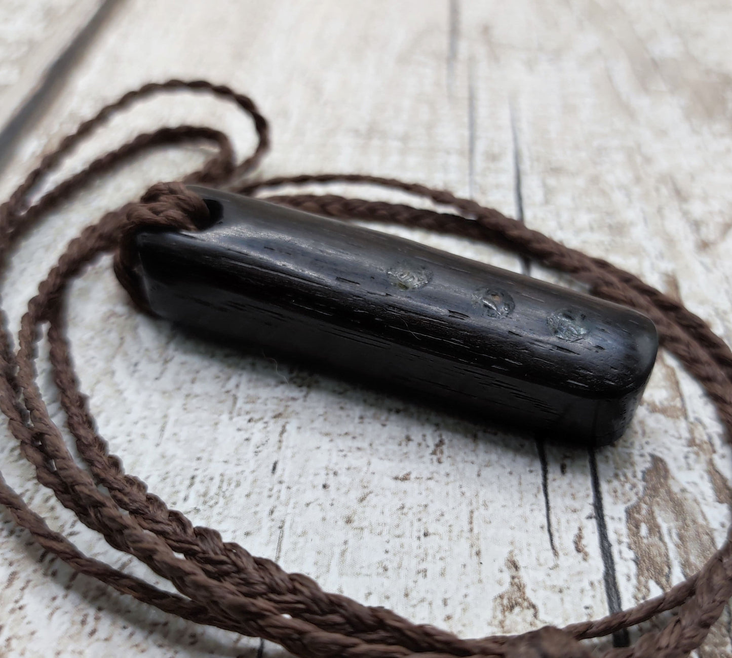 Bog oak wood and moldavite roimata pendant.