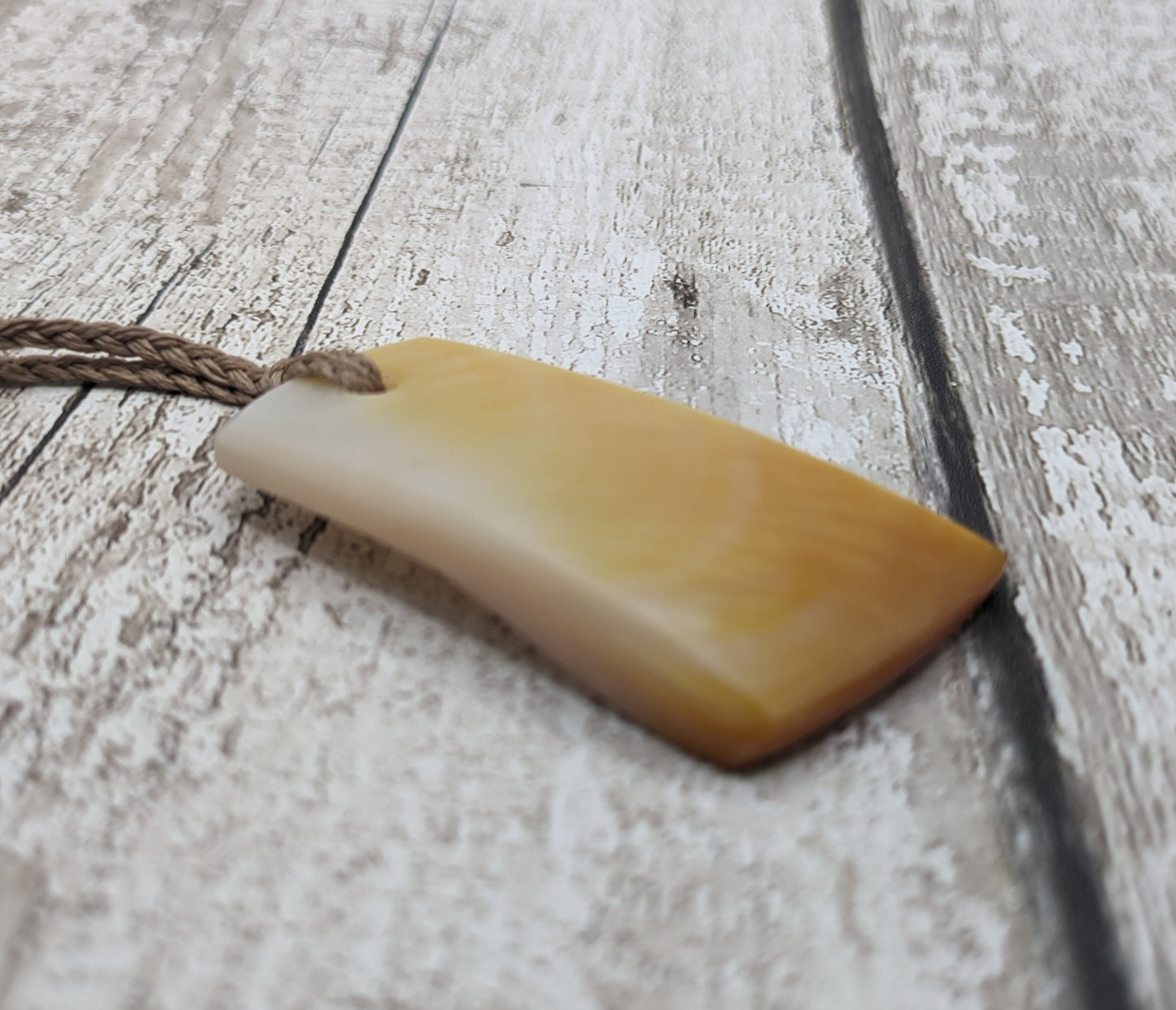 Mother of pearl shell toki styled pendant