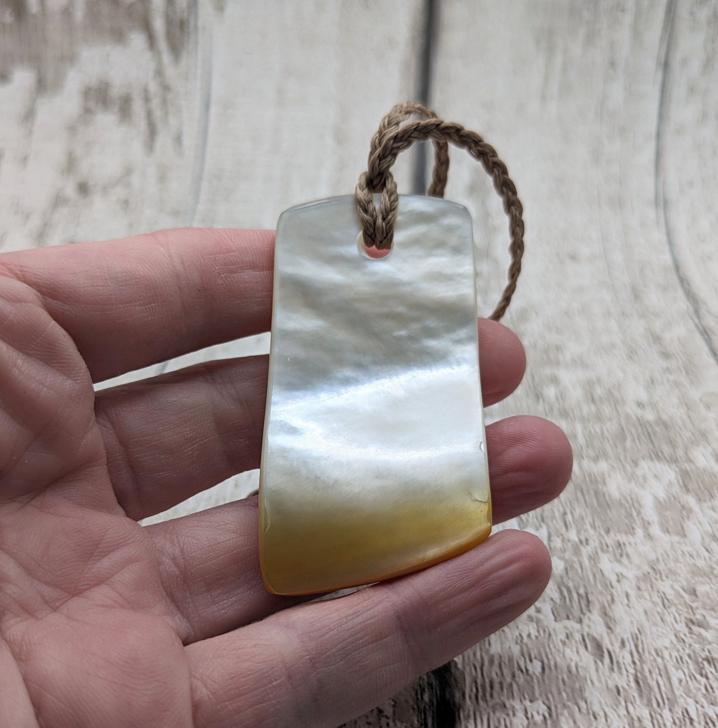 Mother of pearl shell toki styled pendant
