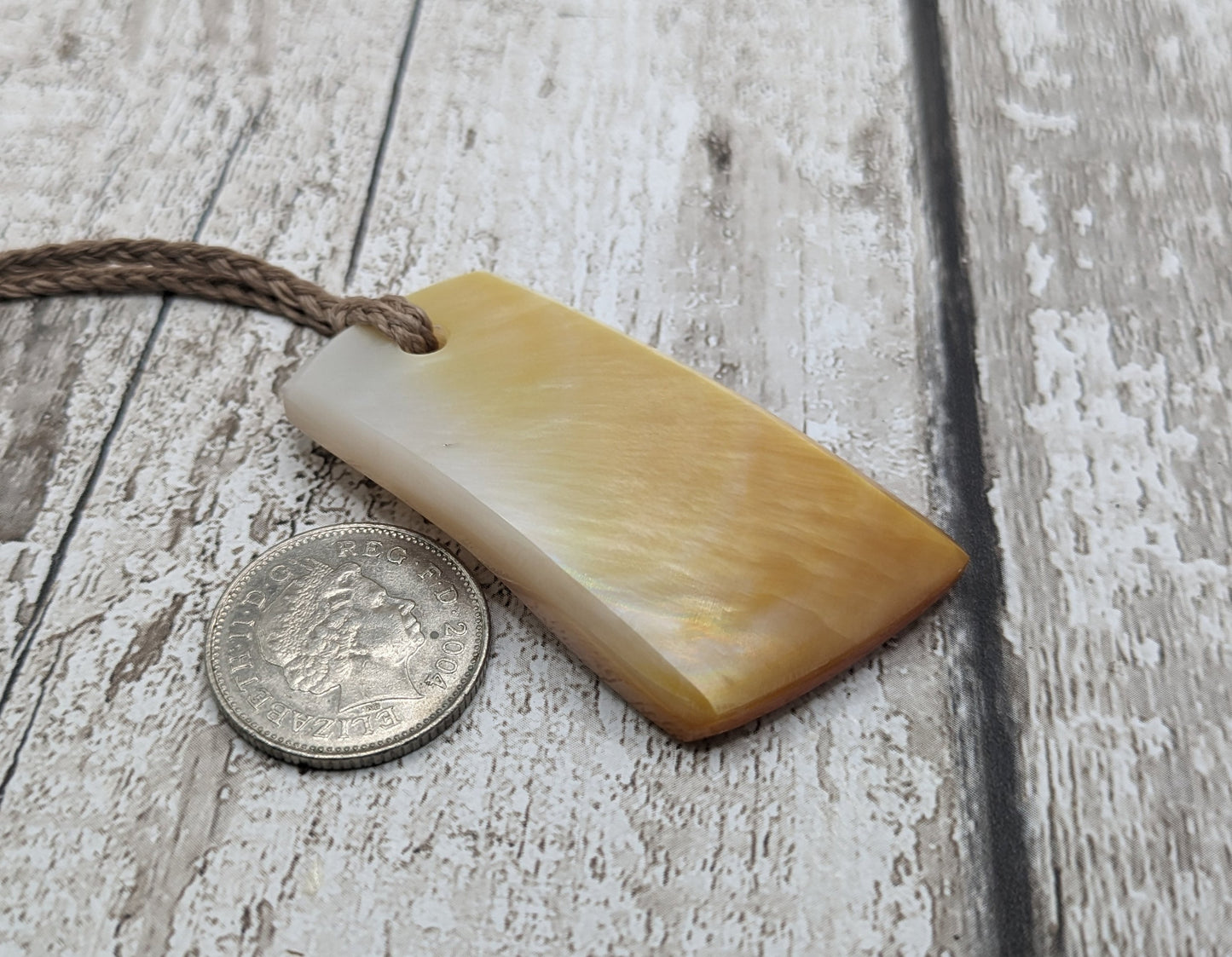 Mother of pearl shell toki styled pendant