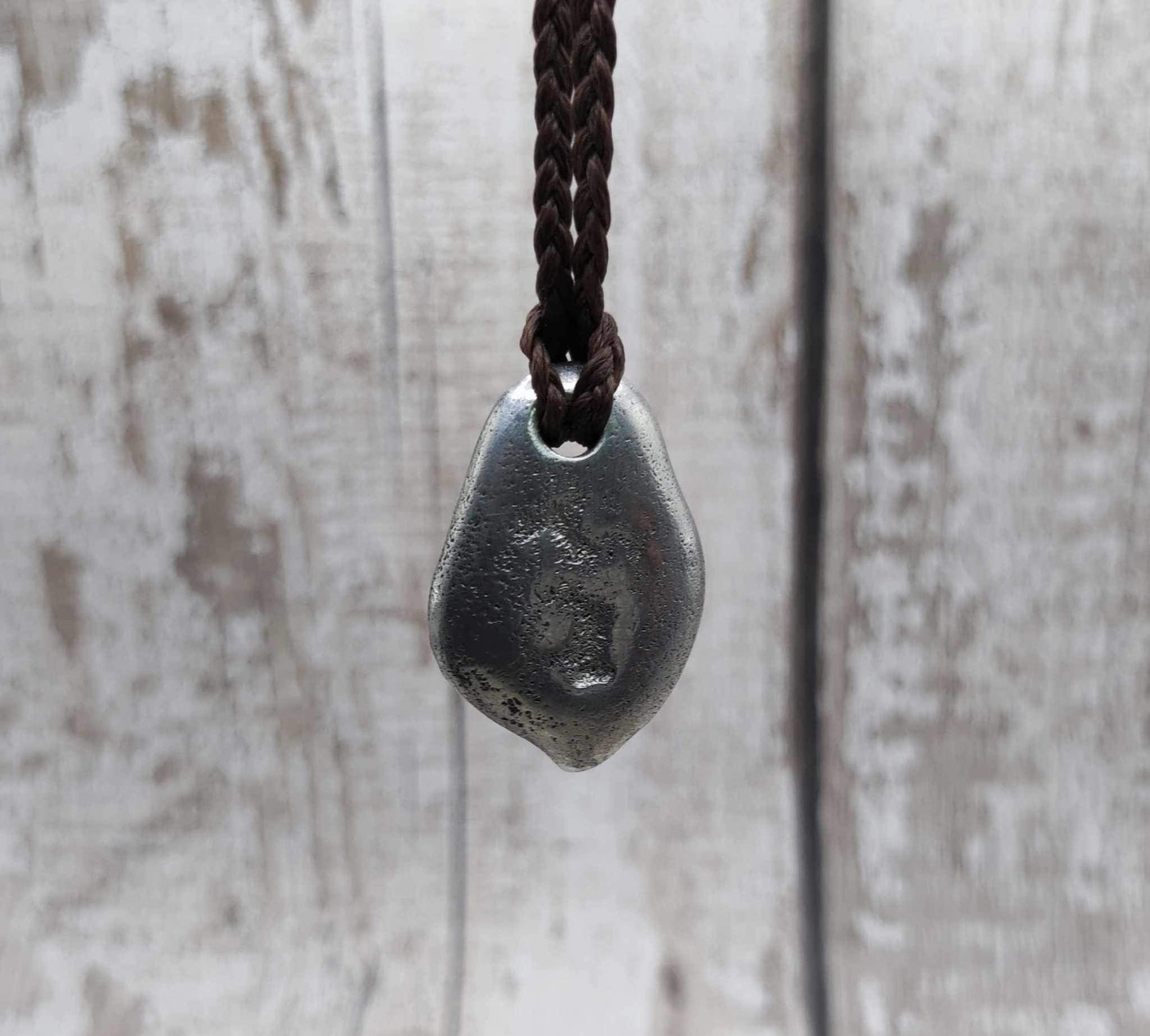 Pewter metal casting ammonite spiral pendant.