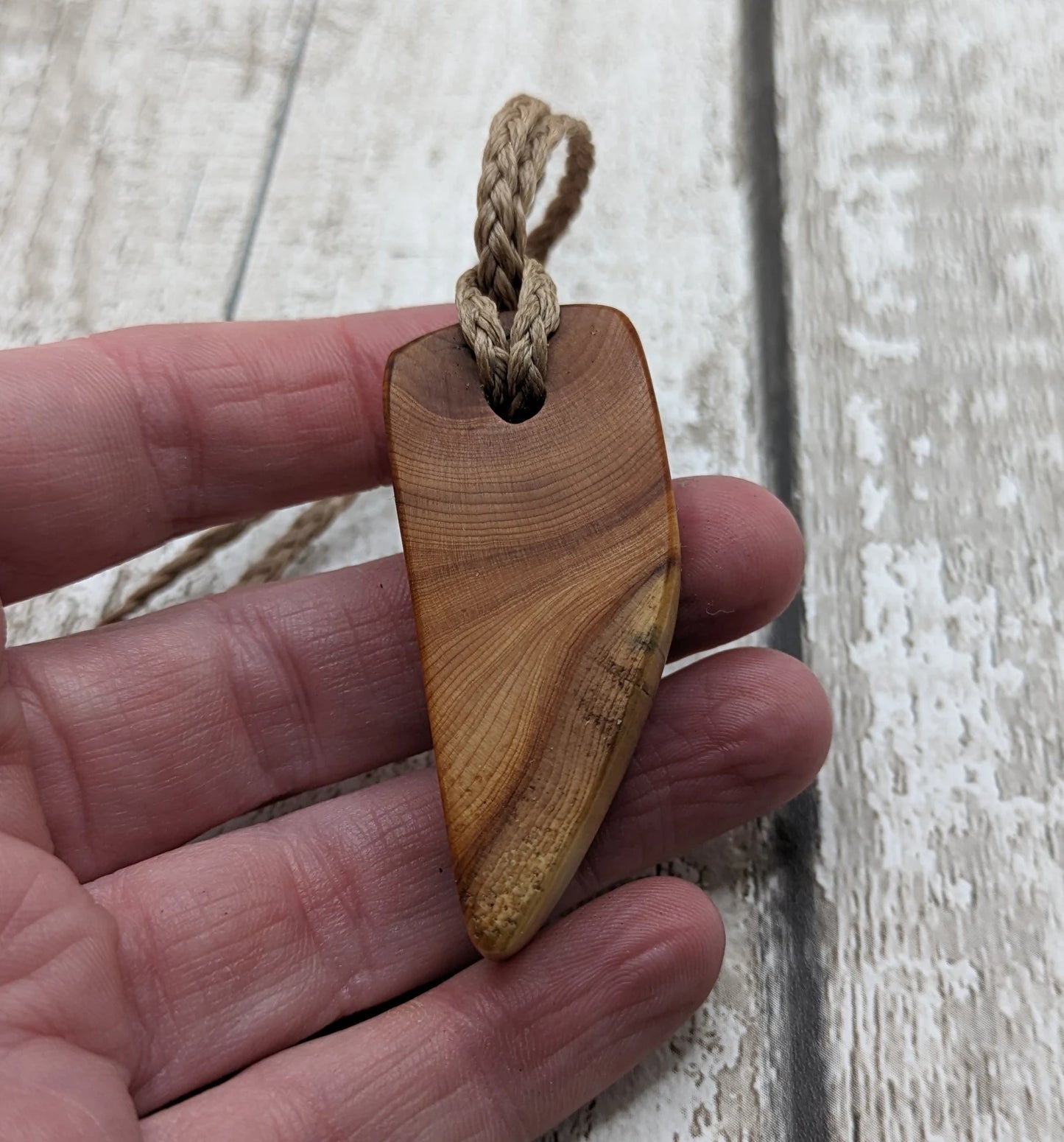 Yew wood slice pendant.