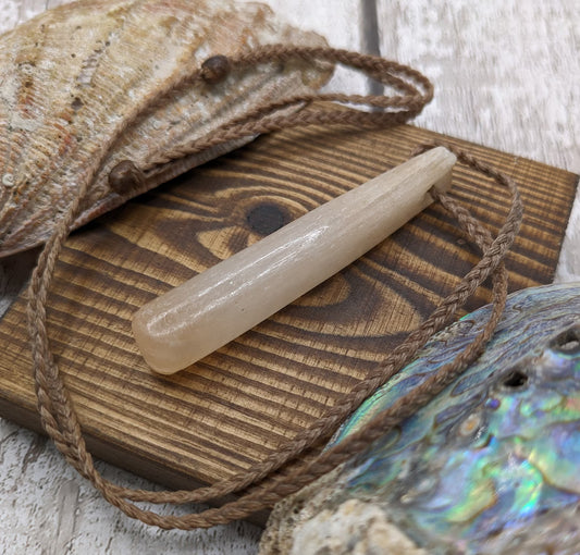 Peach selenite roimata tear drop pendant.