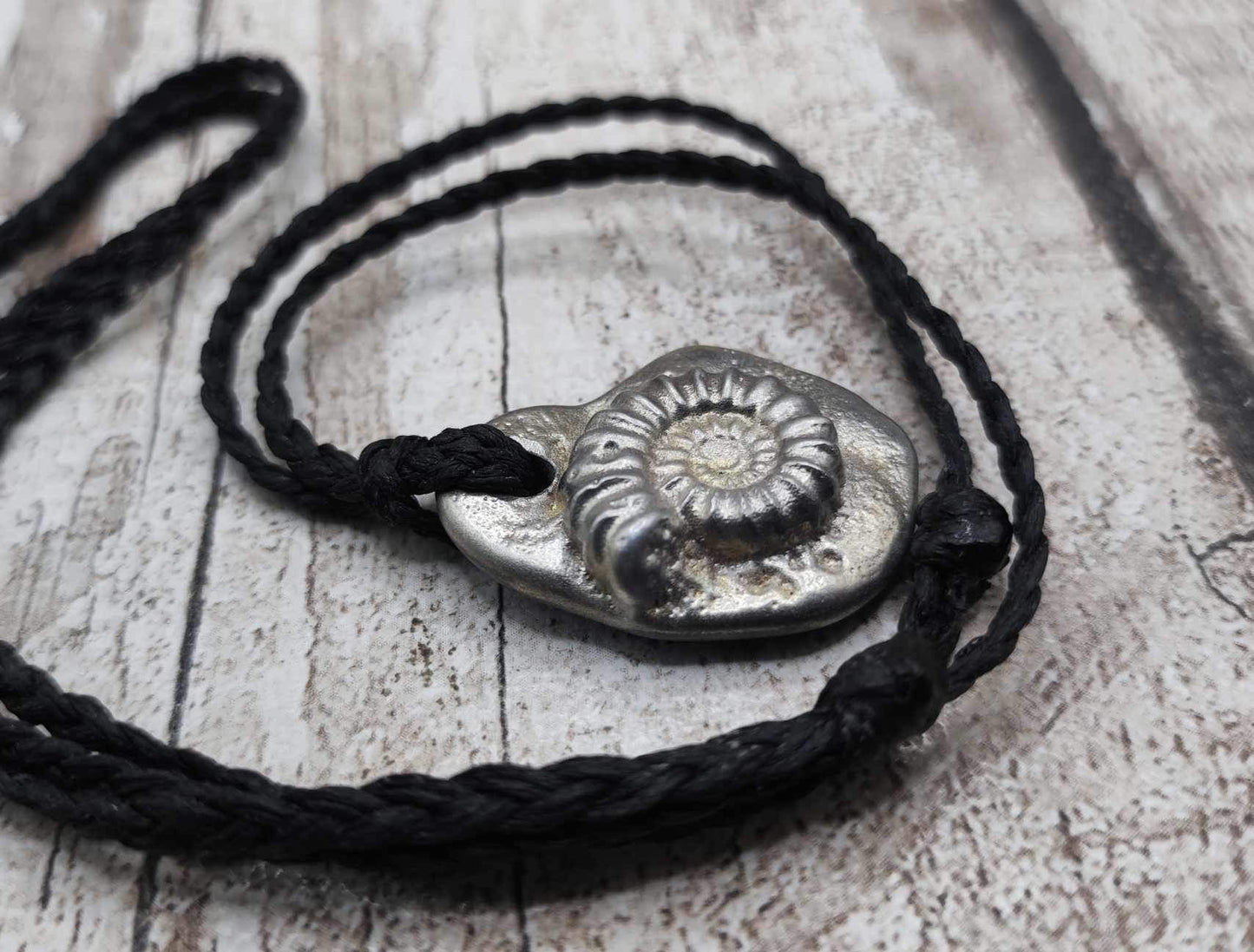 Solid pewter ammonite cast pendant.