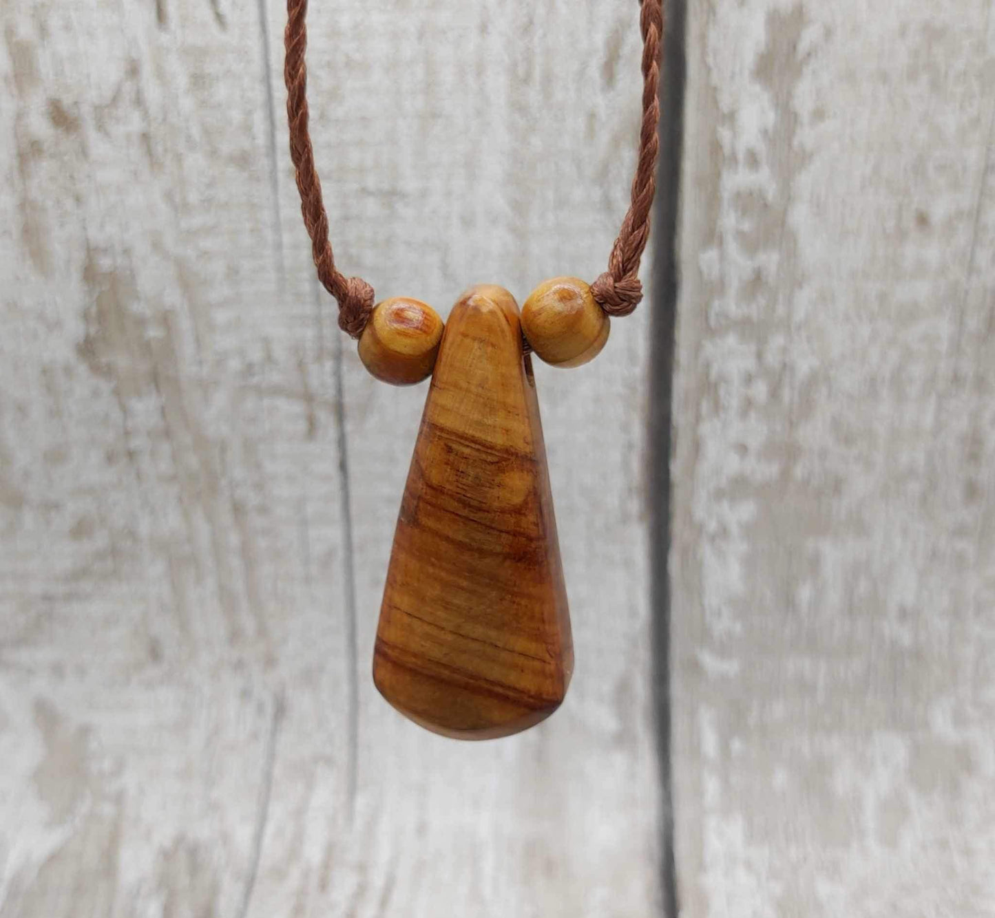 New Zealand Rimu wood and kauri copal gum pendant