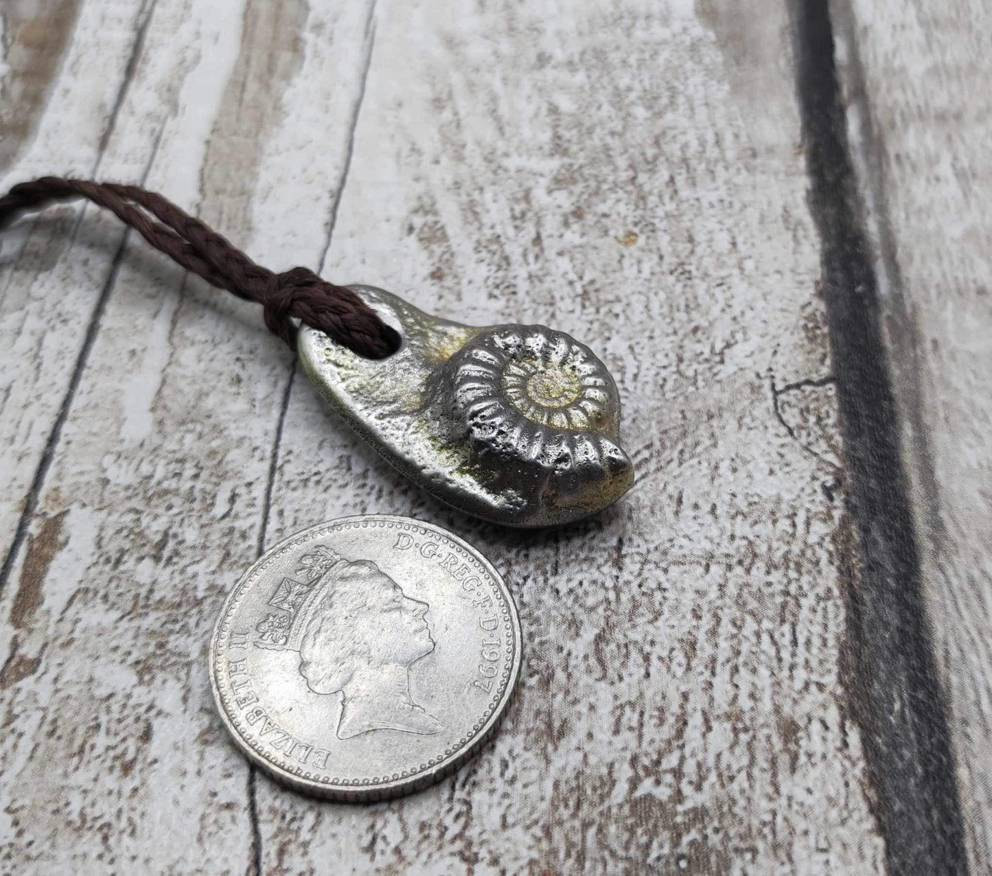 Pewter cast metal ammonite pendant.