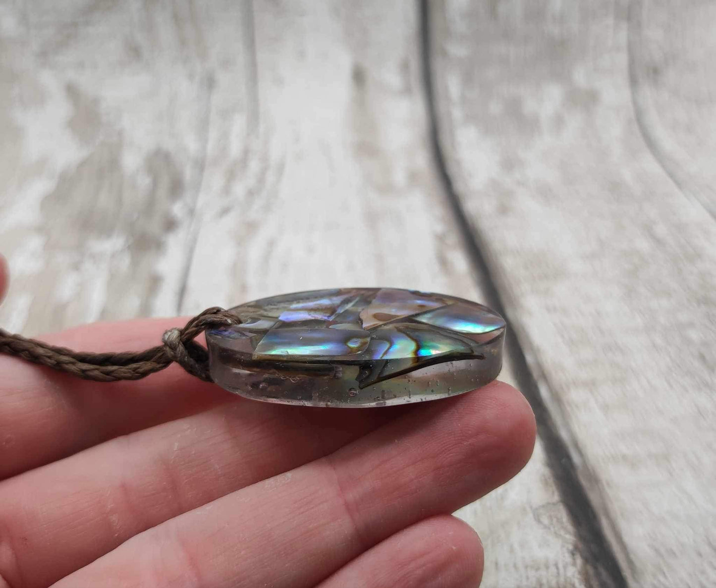 New Zealand Pāua in UV resin pendant.