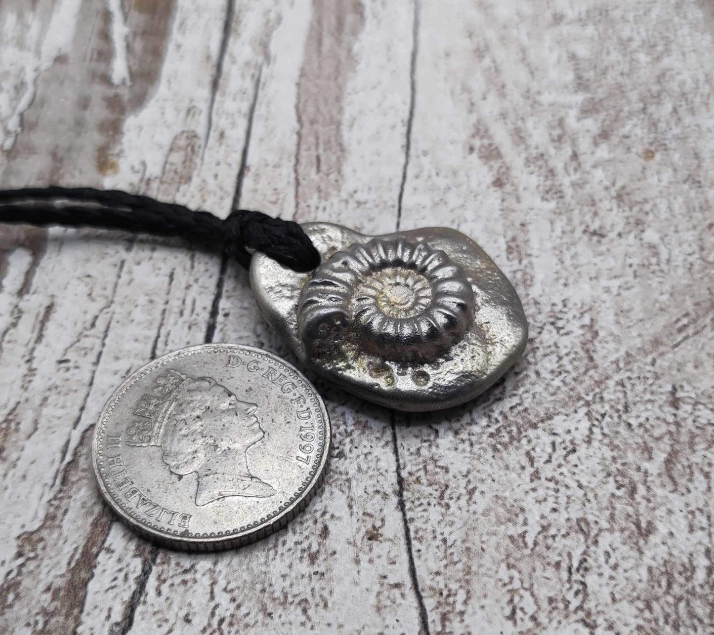 Solid pewter ammonite cast pendant.