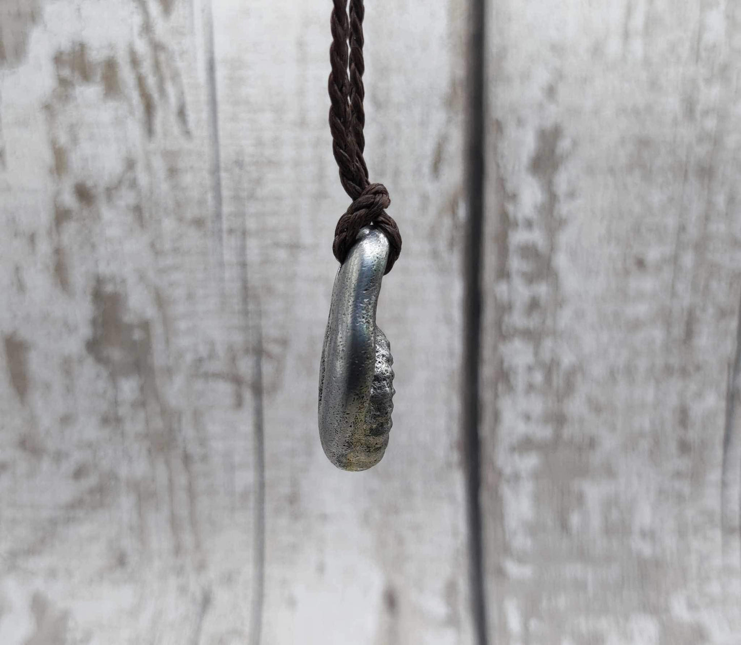 Pewter metal casting ammonite spiral pendant.