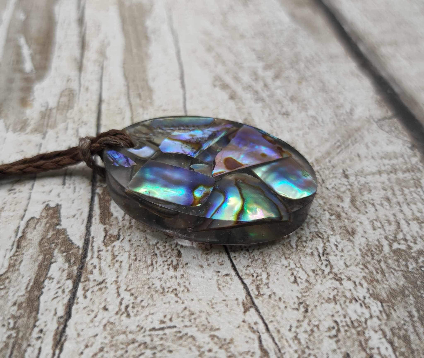 New Zealand Pāua in UV resin pendant.