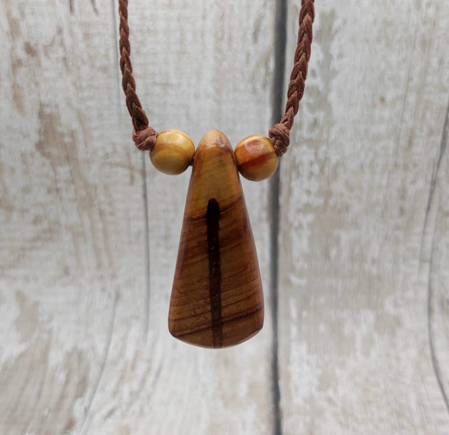 New Zealand Rimu wood and kauri copal gum pendant