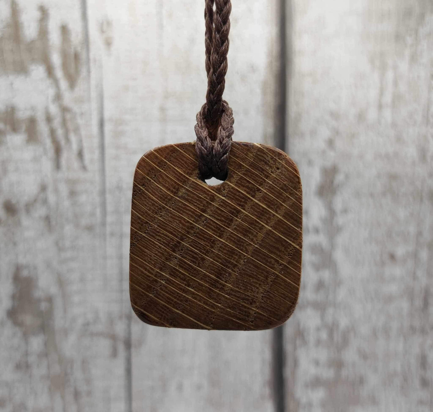 Oak wood jera Viking rune Christmas decoration with Pāua shell.