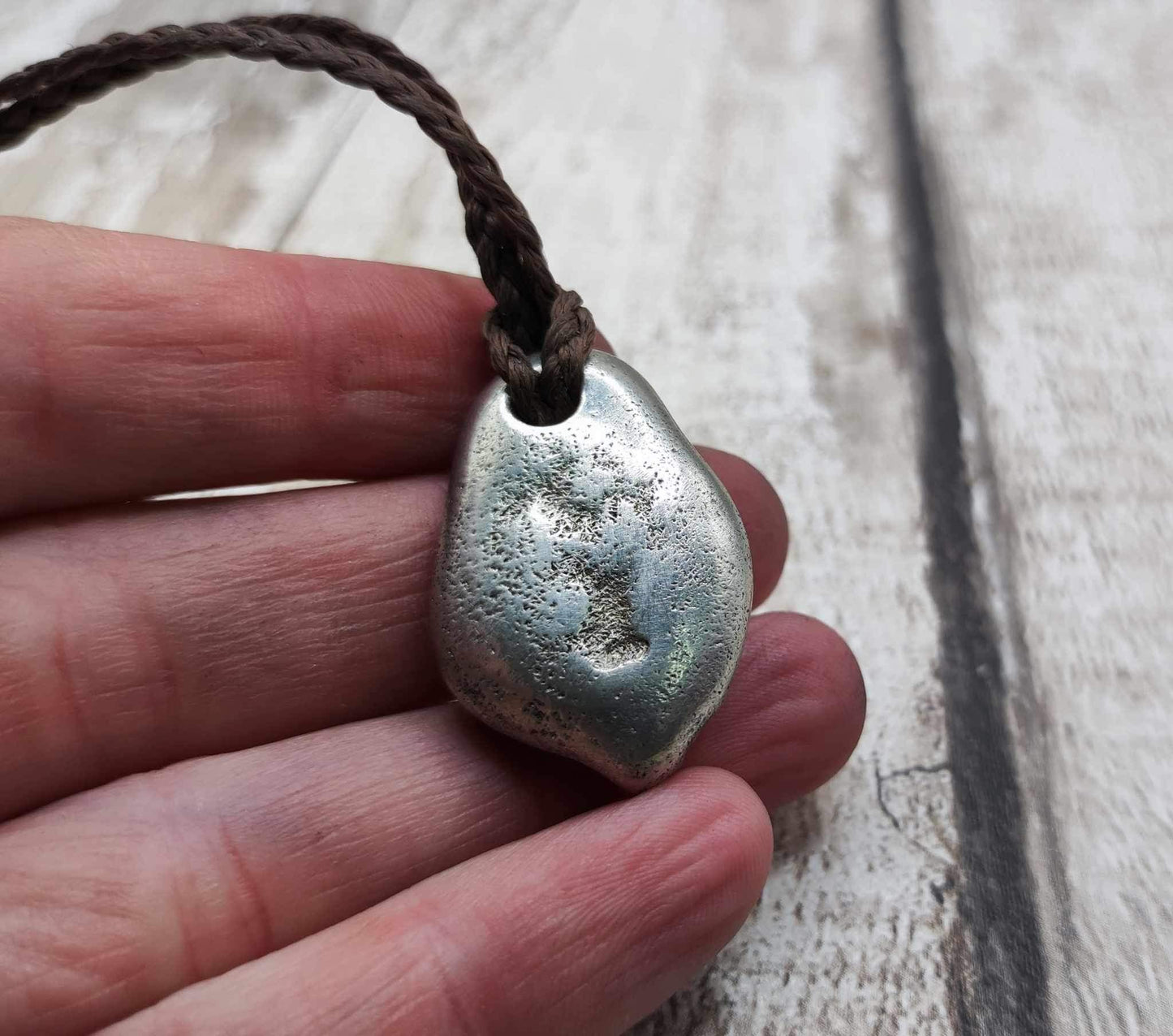 Pewter metal casting ammonite spiral pendant.