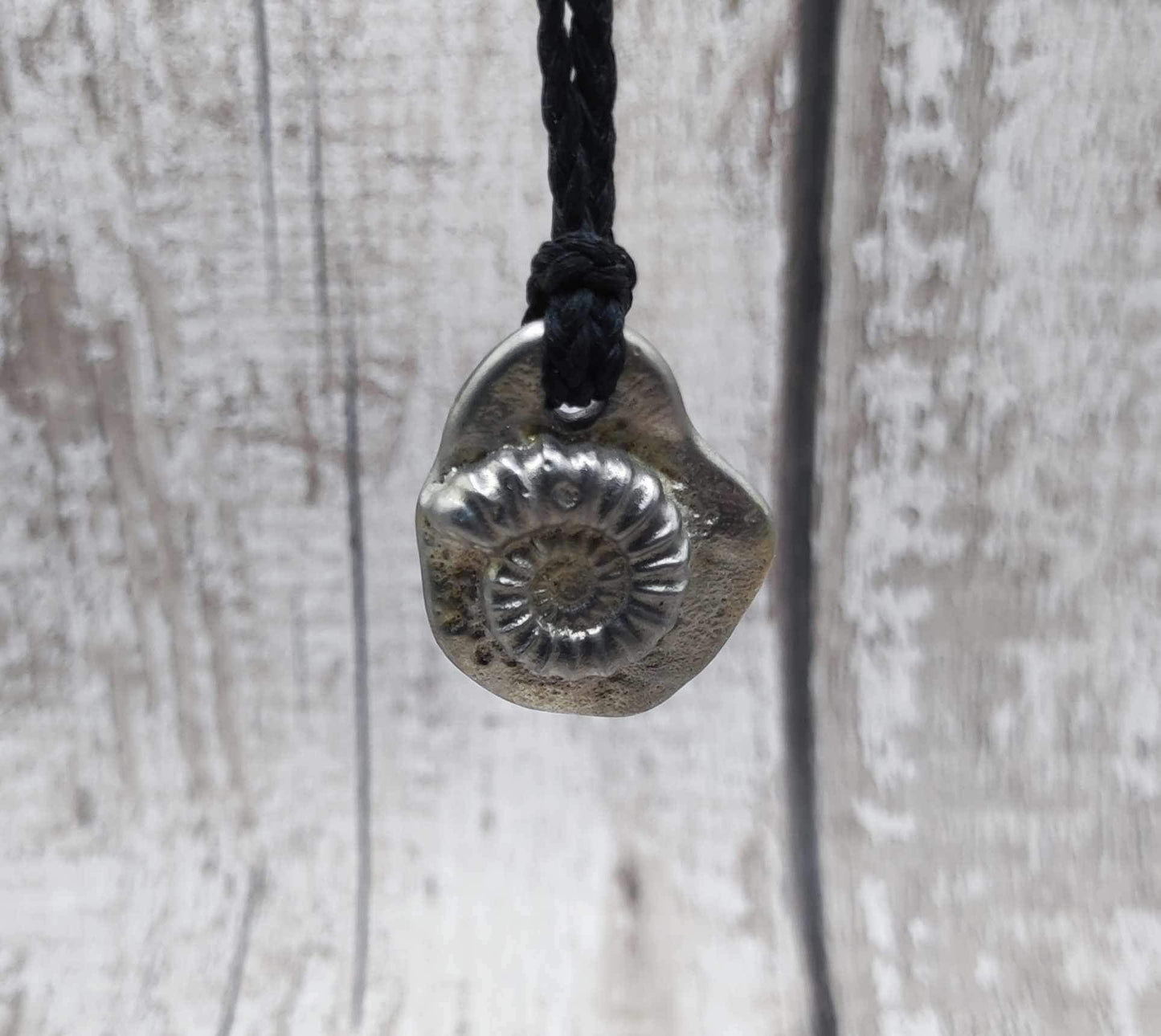 Solid pewter ammonite cast pendant.