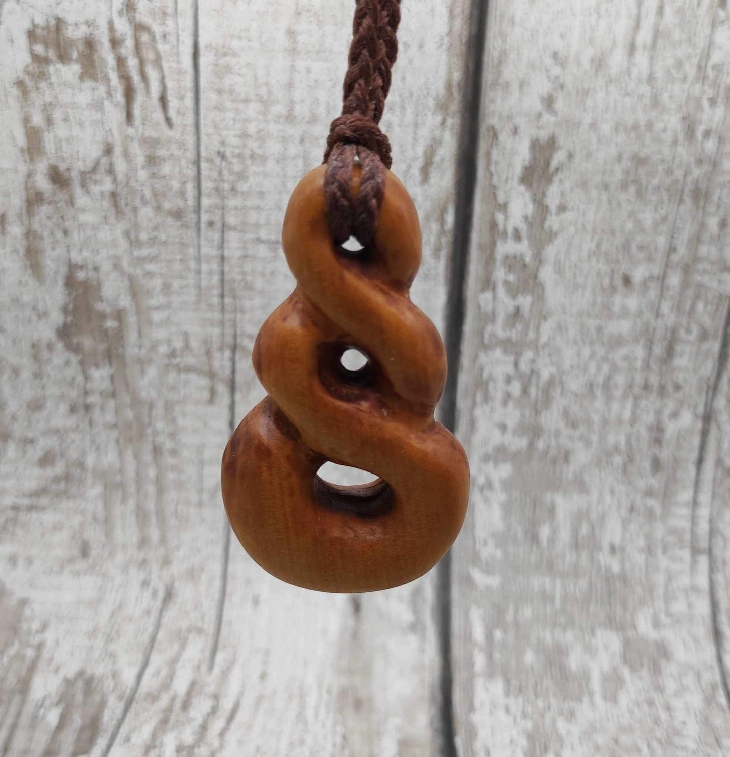 New Zealand Rimu wood pink ours infinity pendant.