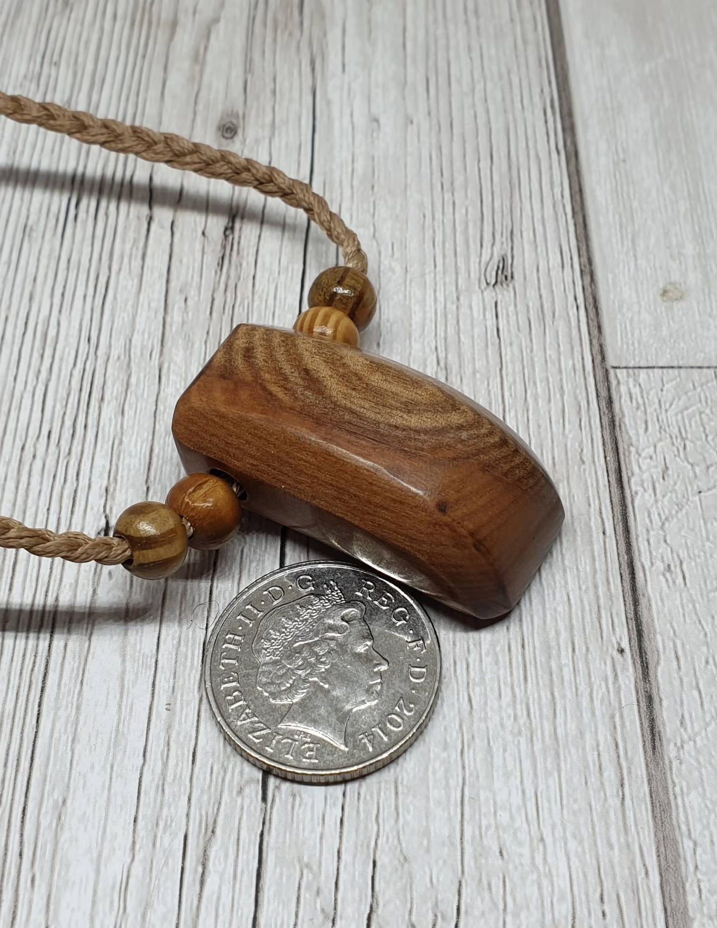 New Zealand Rimu wood unisex pendant.