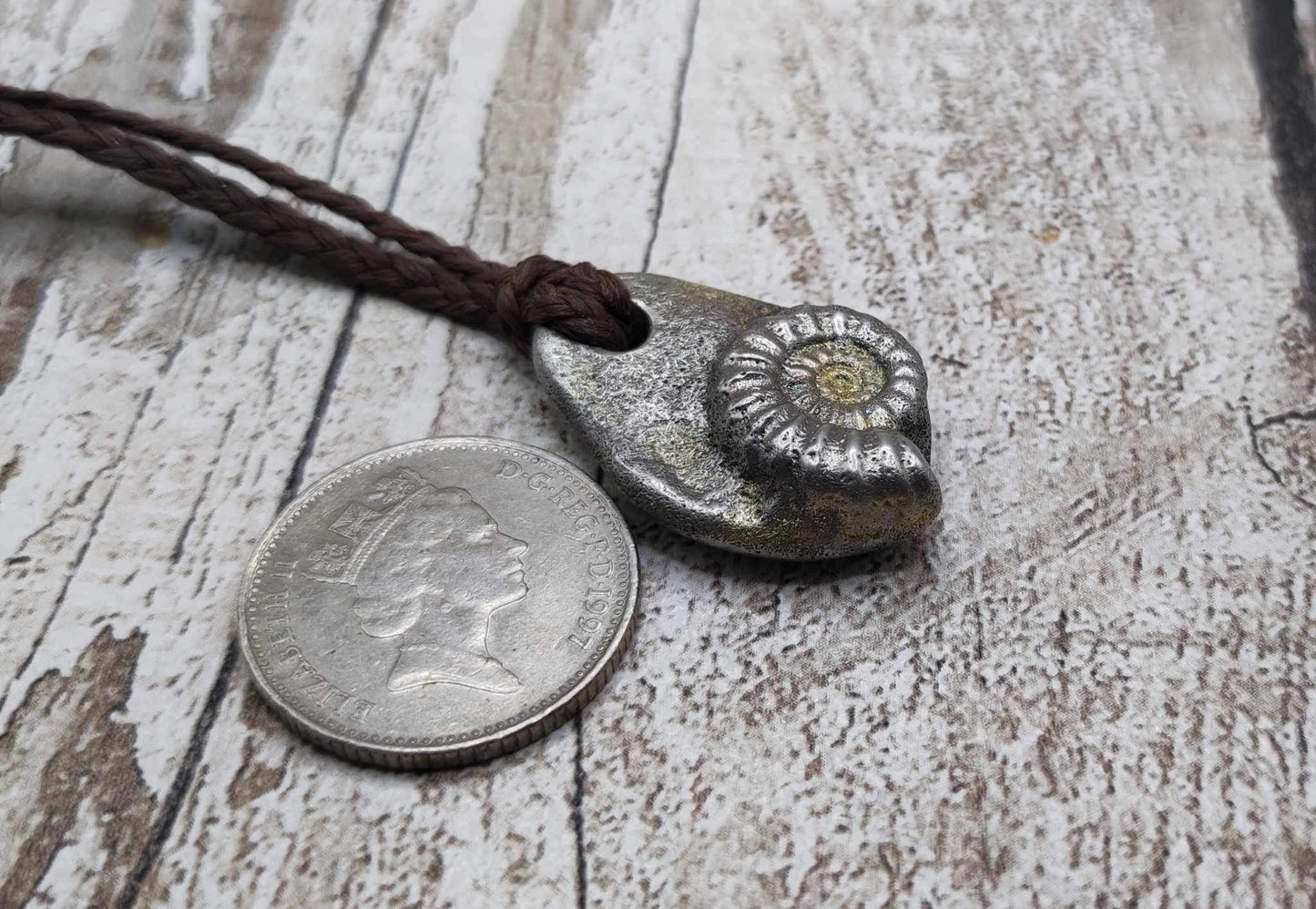 Pewter metal casting ammonite spiral pendant.