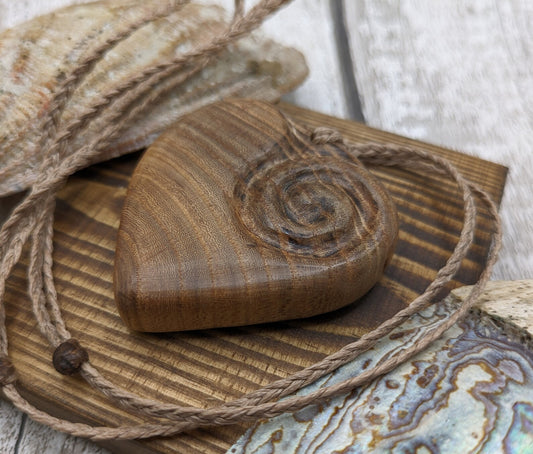 Birch wood Koru heart carved pendant.