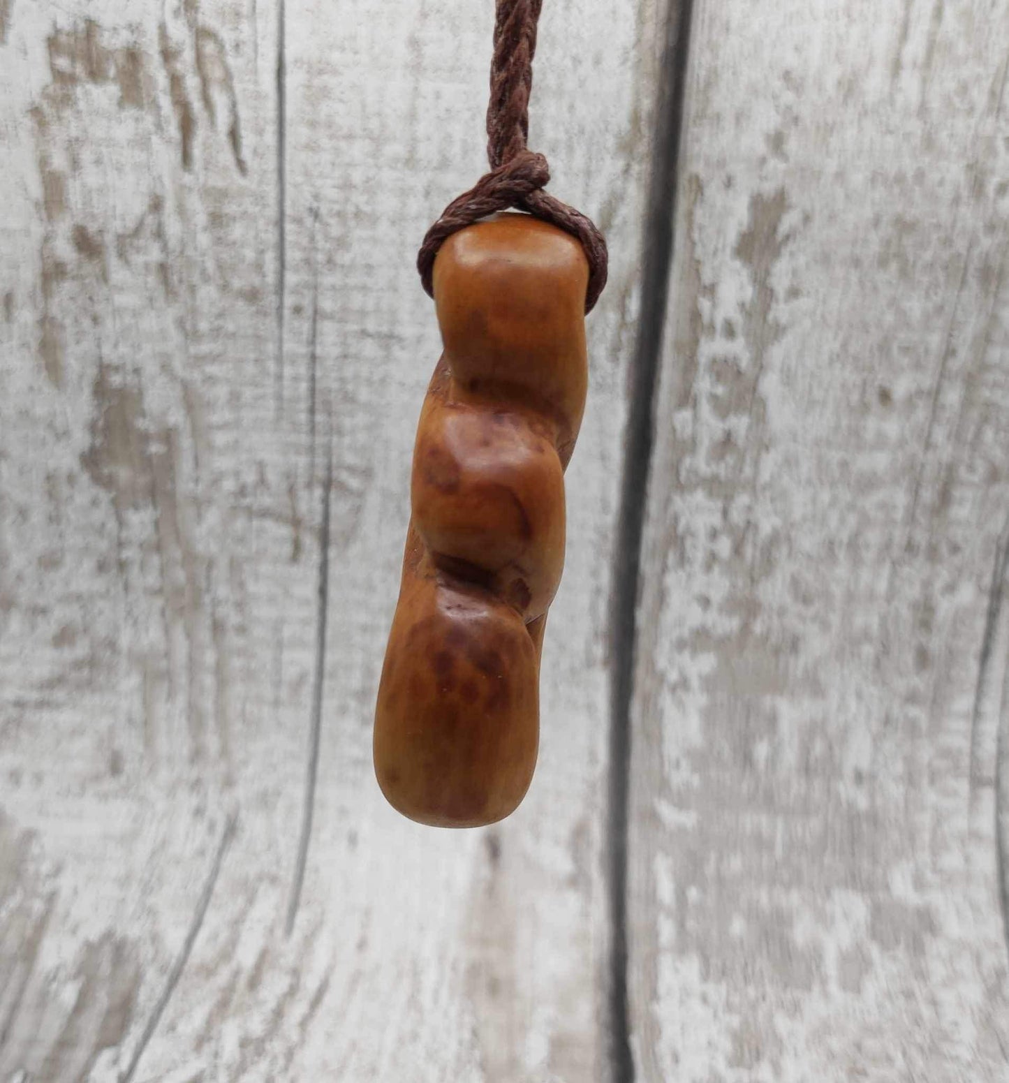 New Zealand Rimu wood pink ours infinity pendant.