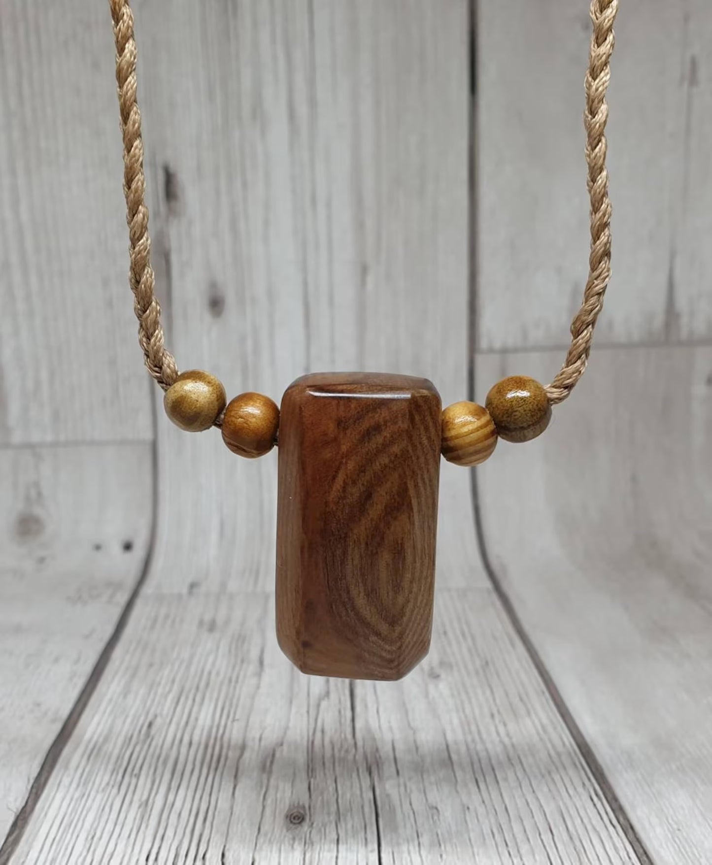 New Zealand Rimu wood unisex pendant.