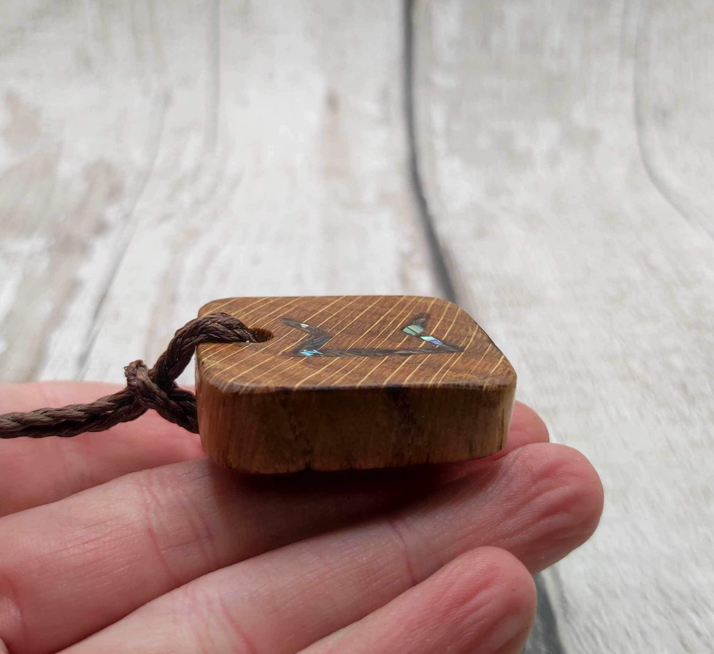 Perthro oak wood rune Christmas decoration with Pāua shell inlay.